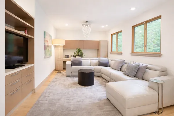 a living room with furniture and a flat screen tv