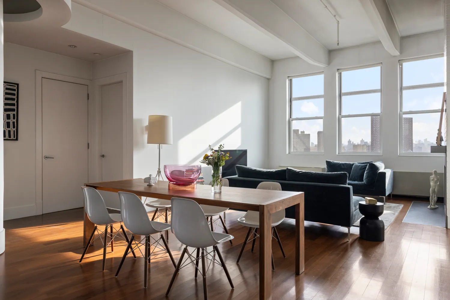 a view of a dining room with furniture window and wooden floor