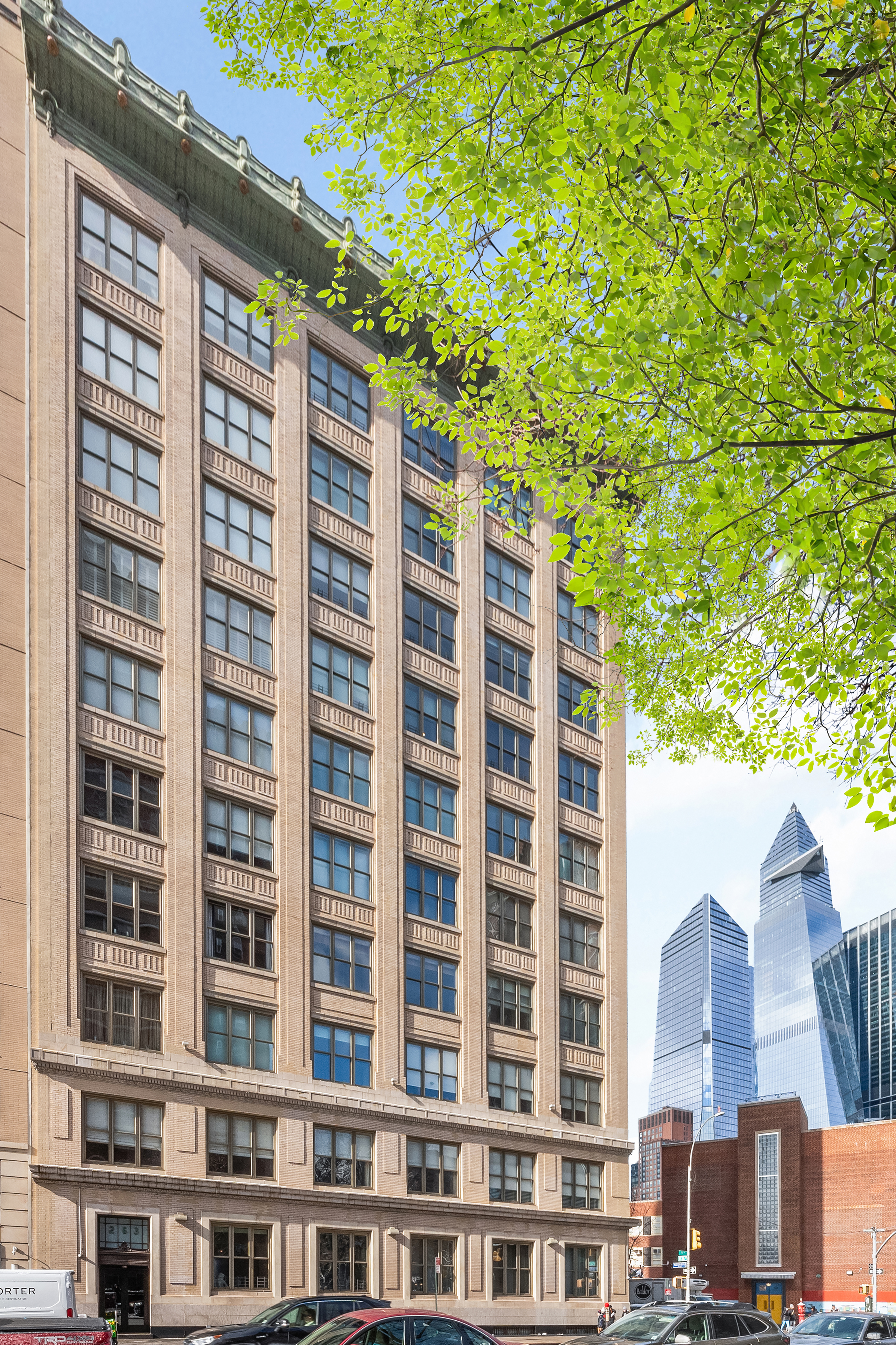 263 9th Avenue, Unit 7E Manhattan, NY 10001 - Photo 13 of 17 a front view of a building with a tree