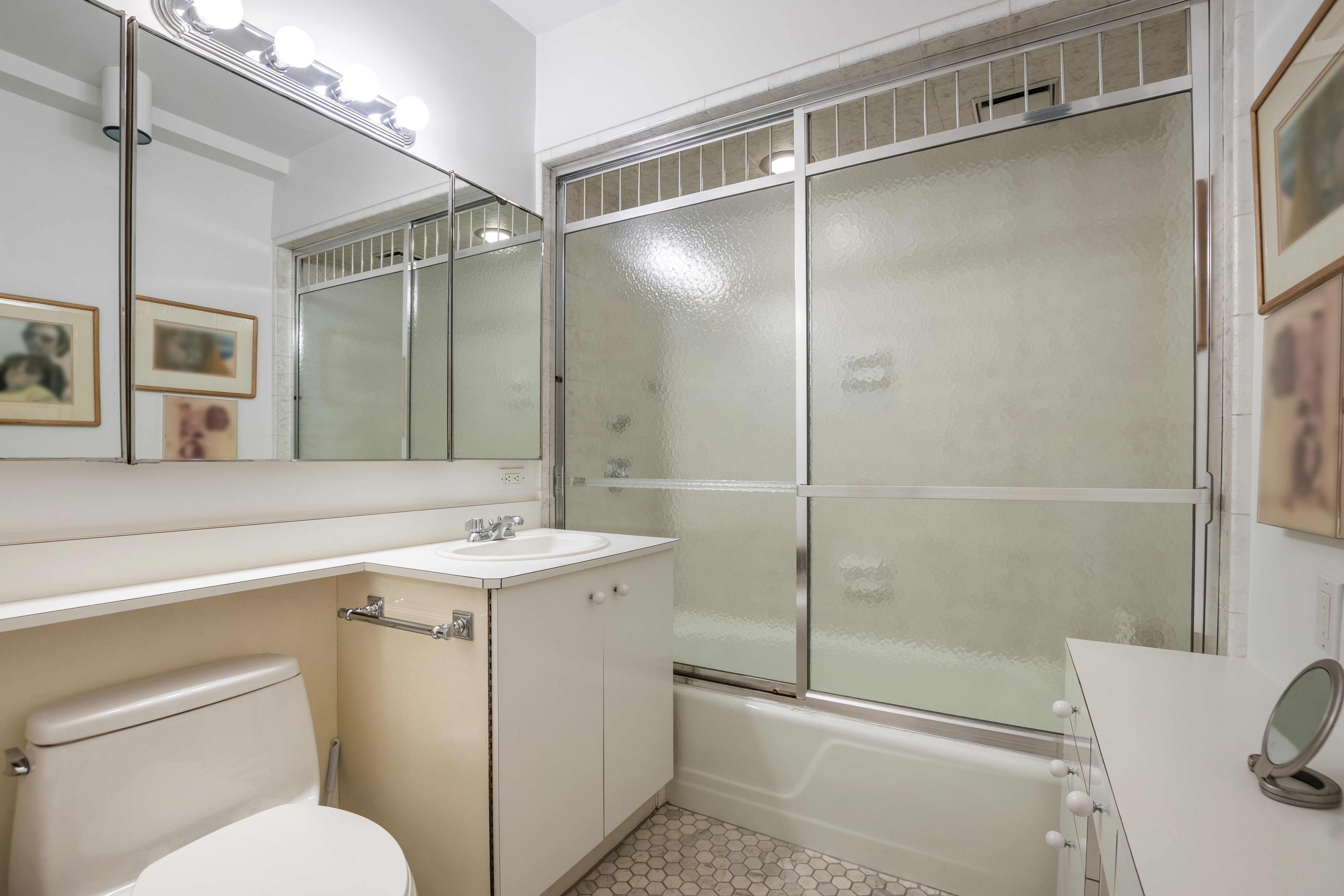 575 Park Avenue, Unit 407 Manhattan, NY 10065 - Photo 9 of 14 a bathroom with a sink toilet and shower
