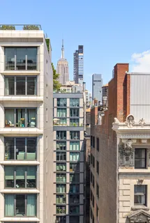 a view of buildings with a street