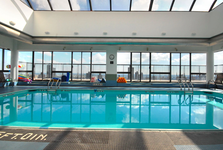 171 East 84th Street, Unit 22C Manhattan, NY 10028 - Photo 14 of 17 a kitchen with a large window