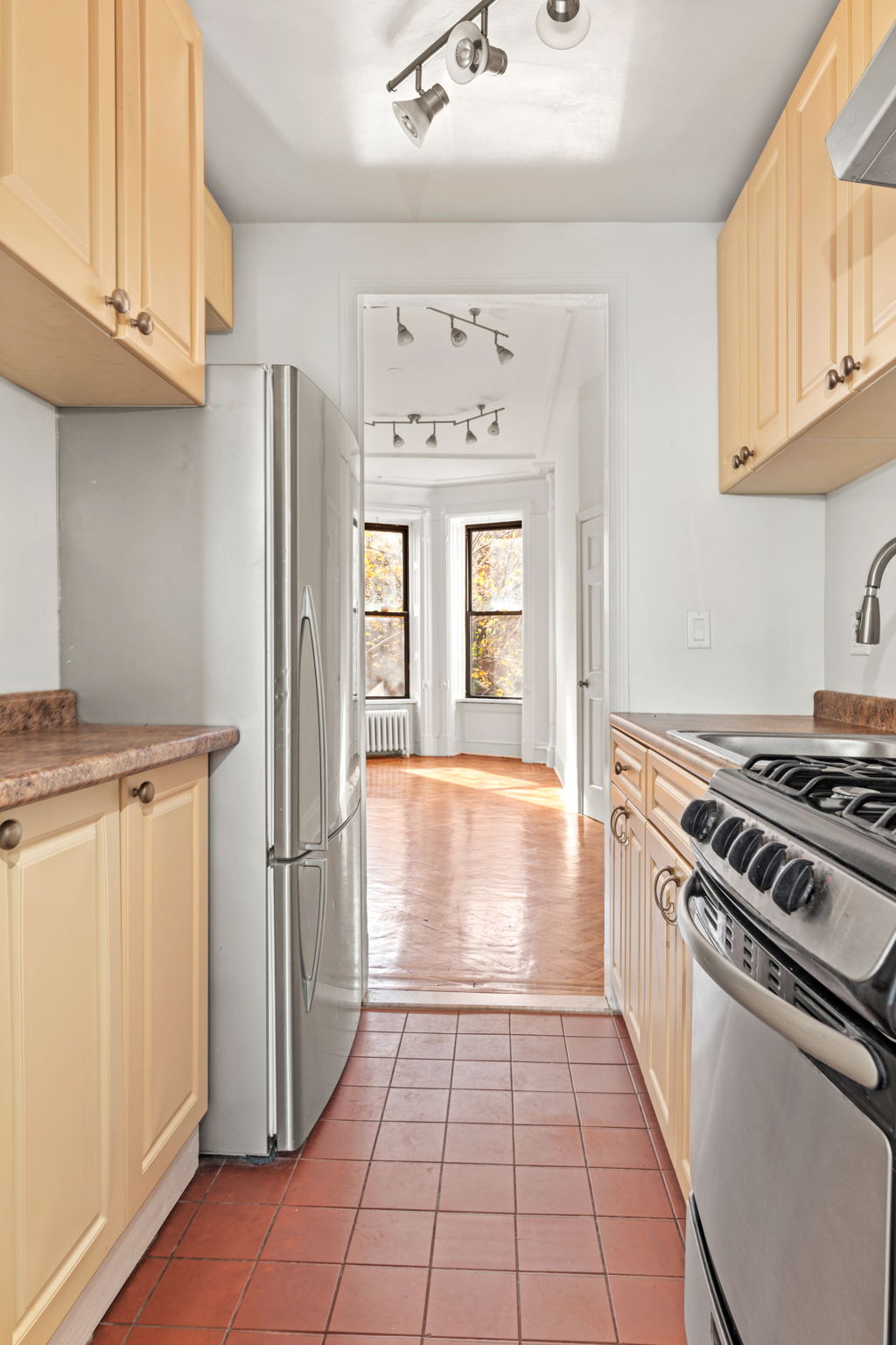149 Sterling Place, Unit 3 Brooklyn, NY 11217 - Photo 7 of 9 a kitchen with a stove a refrigerator and a stove
