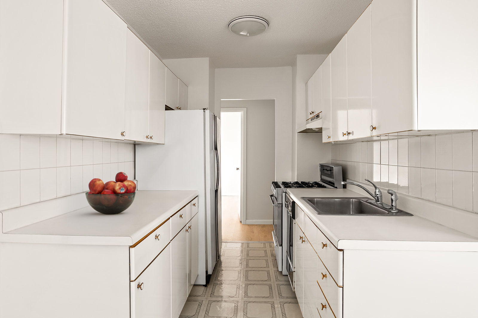 39-60 54th Street, Unit 4R Queens, NY 11377 - Photo 3 of 14 a kitchen that has a sink and a stove