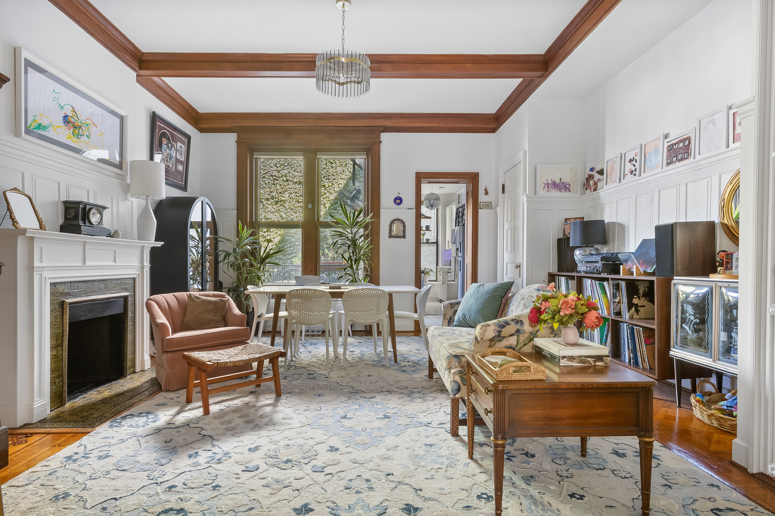 227 Garfield Place, Unit Garden Duplex Brooklyn, NY 11215 - Photo 2 of 15 a living room with furniture a fireplace and a flat screen tv
