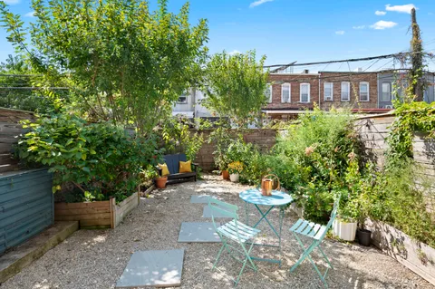 a view of a chairs and table in a patio
