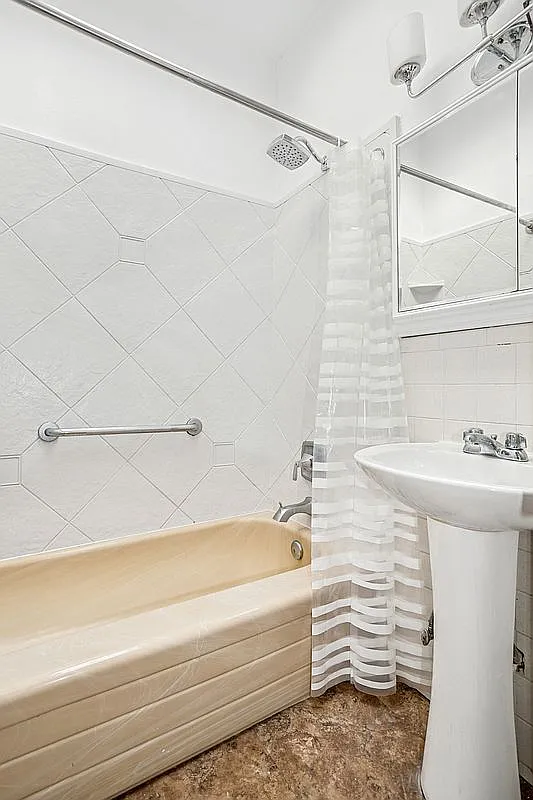 441 MacDonough Street Brooklyn, NY 11233 - Photo 12 of 13 a bathroom with a sink and a bathtub