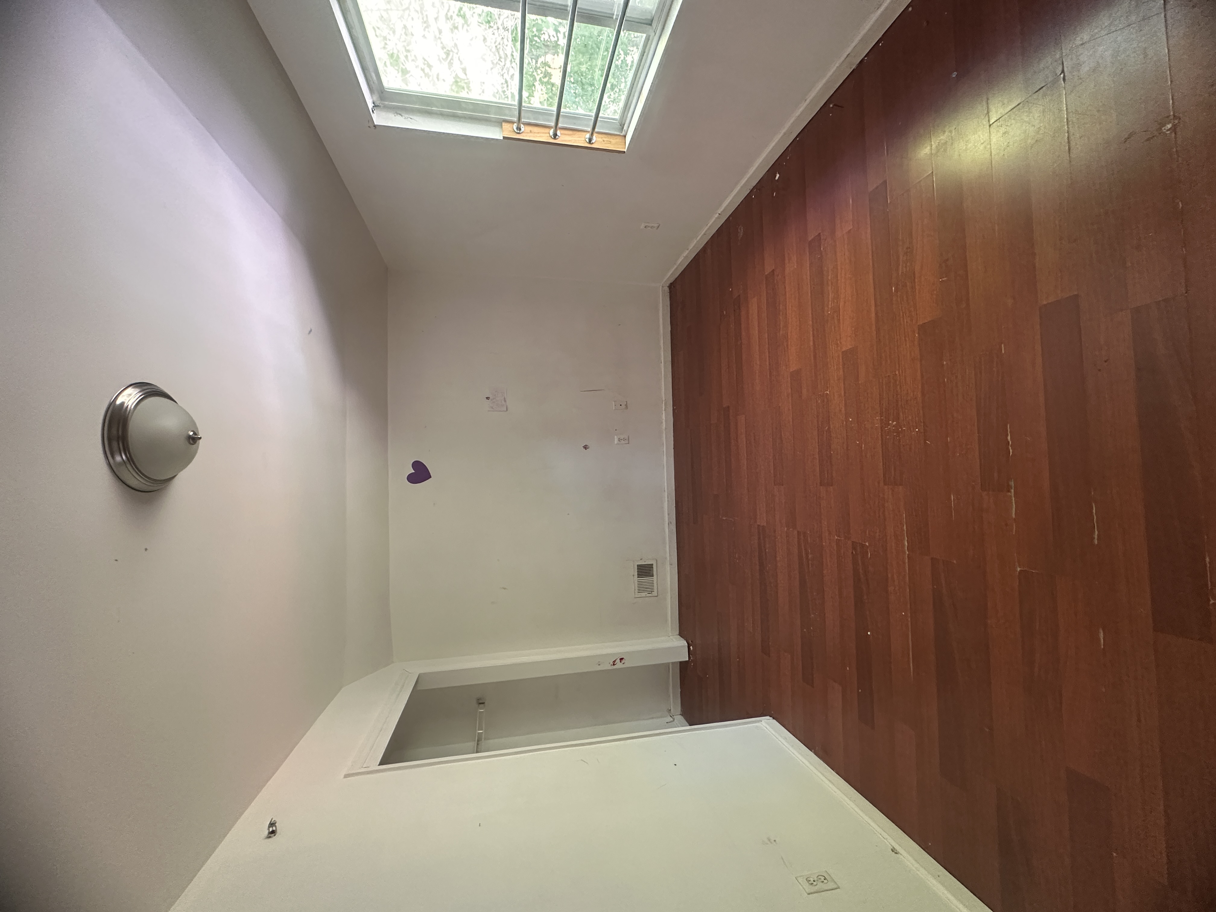 165 Brighton Avenue Staten Island, NY 10301 - Photo 8 of 8 an empty room with a window