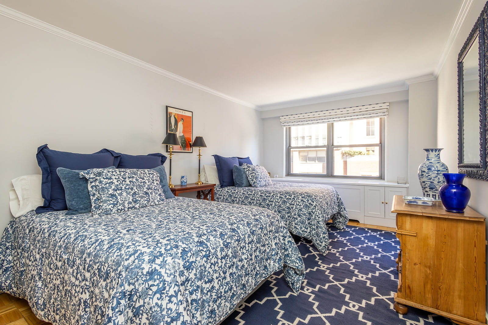 132 East 35th Street, Unit 7H Manhattan, NY 10016 - Photo 14 of 25 a bedroom with a bed and wooden floor