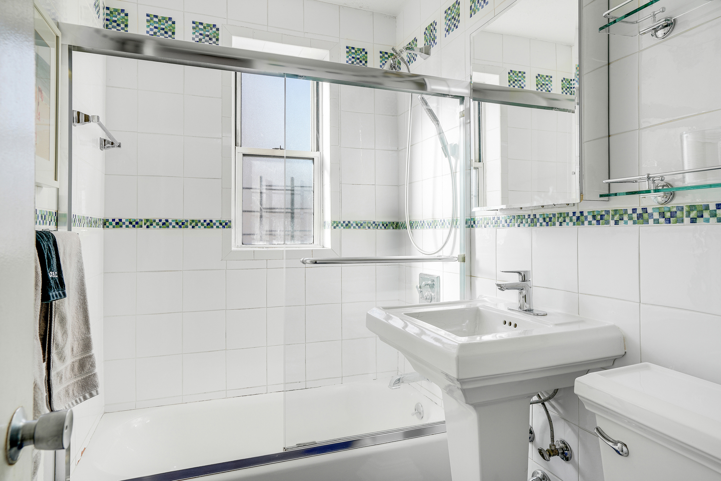 201 East 37th Street, Unit 11D Manhattan, NY 10016 - Photo 10 of 11 a bathroom with a sink toilet and shower