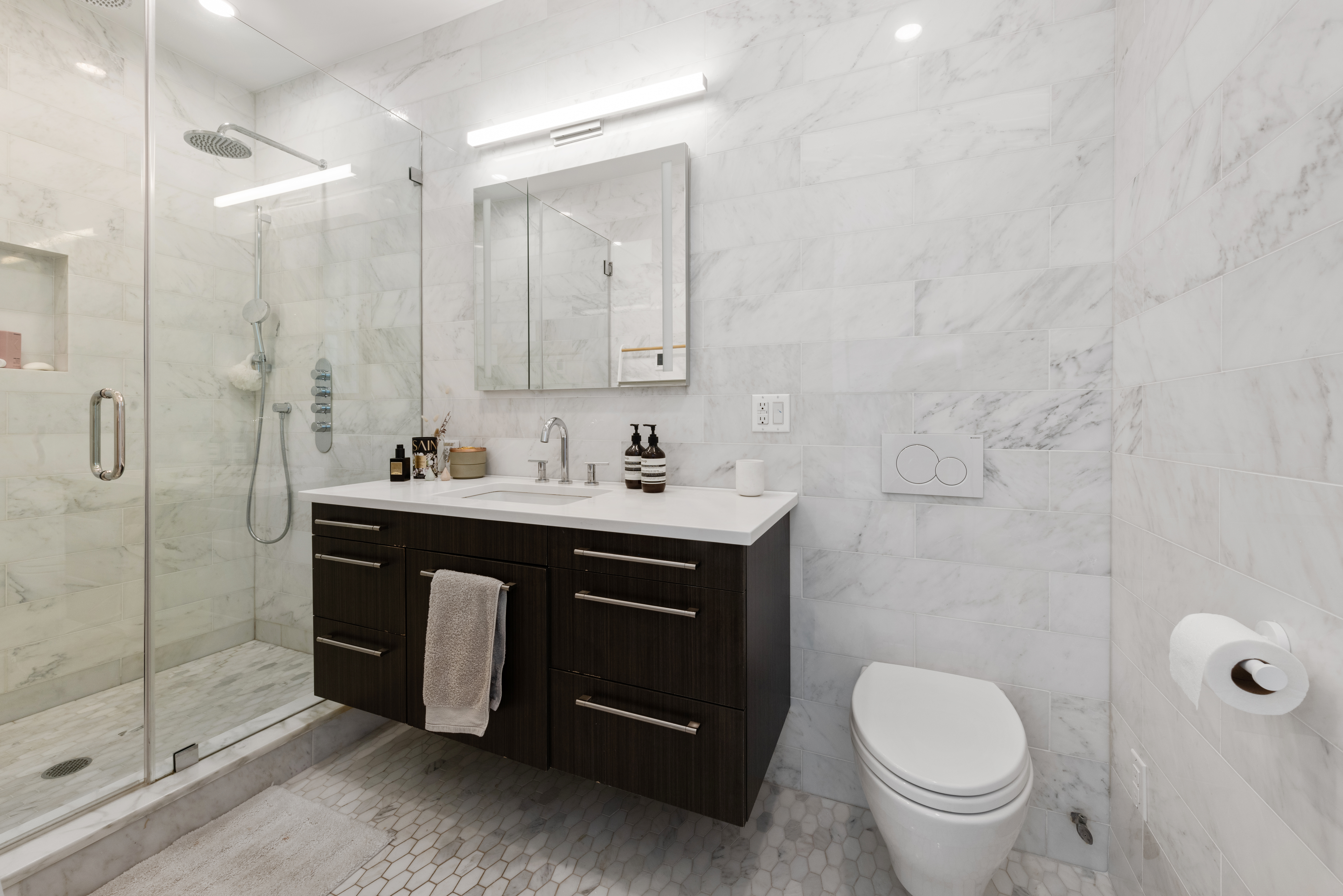 102 Huron Street, Unit 3B Brooklyn, NY 11222 - Photo 11 of 18 a bathroom with a sink toilet and shower
