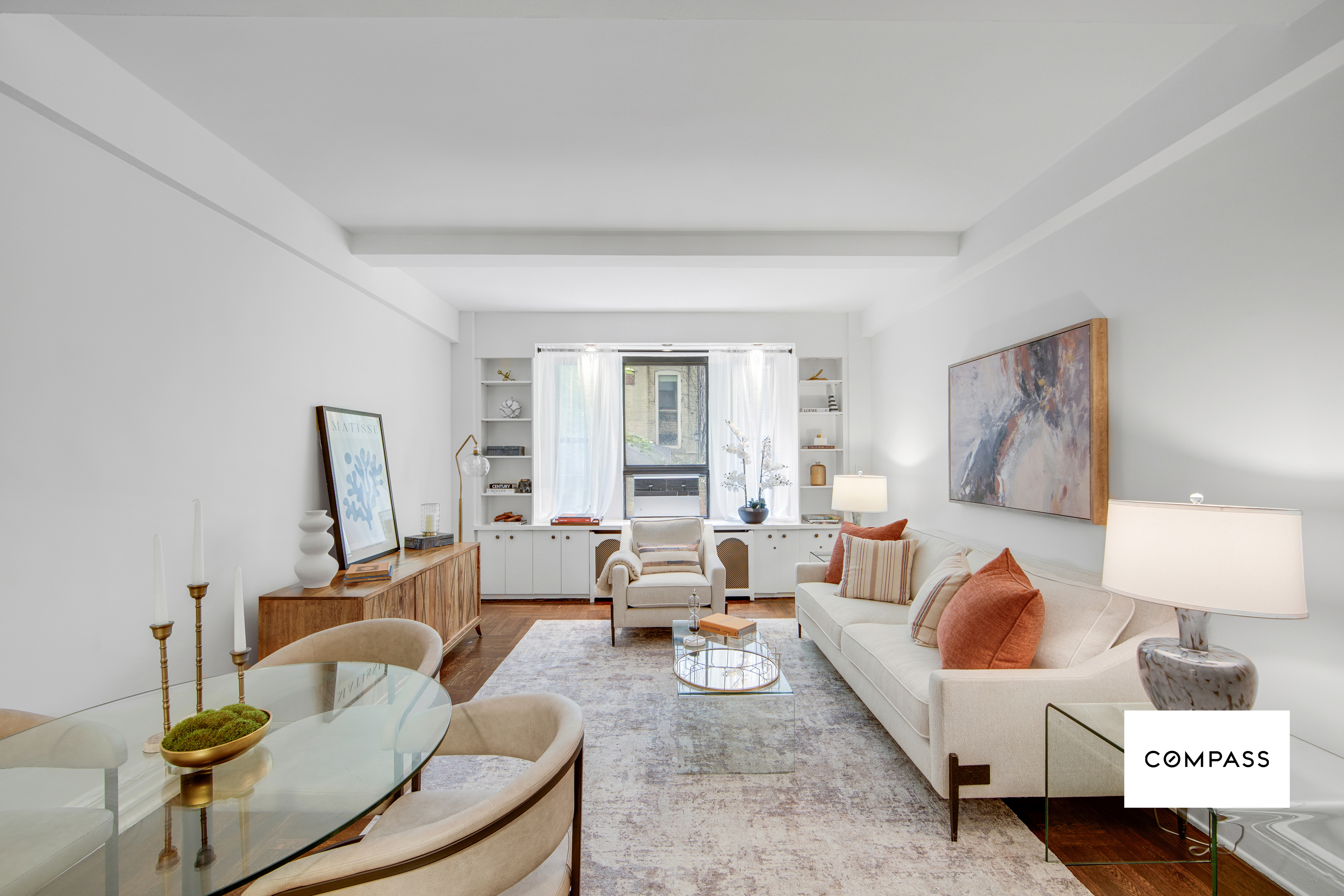 124 East 84th Street, Unit 1D Manhattan, NY 10028 - Photo 2 of 14 a living room with furniture and a flat screen tv