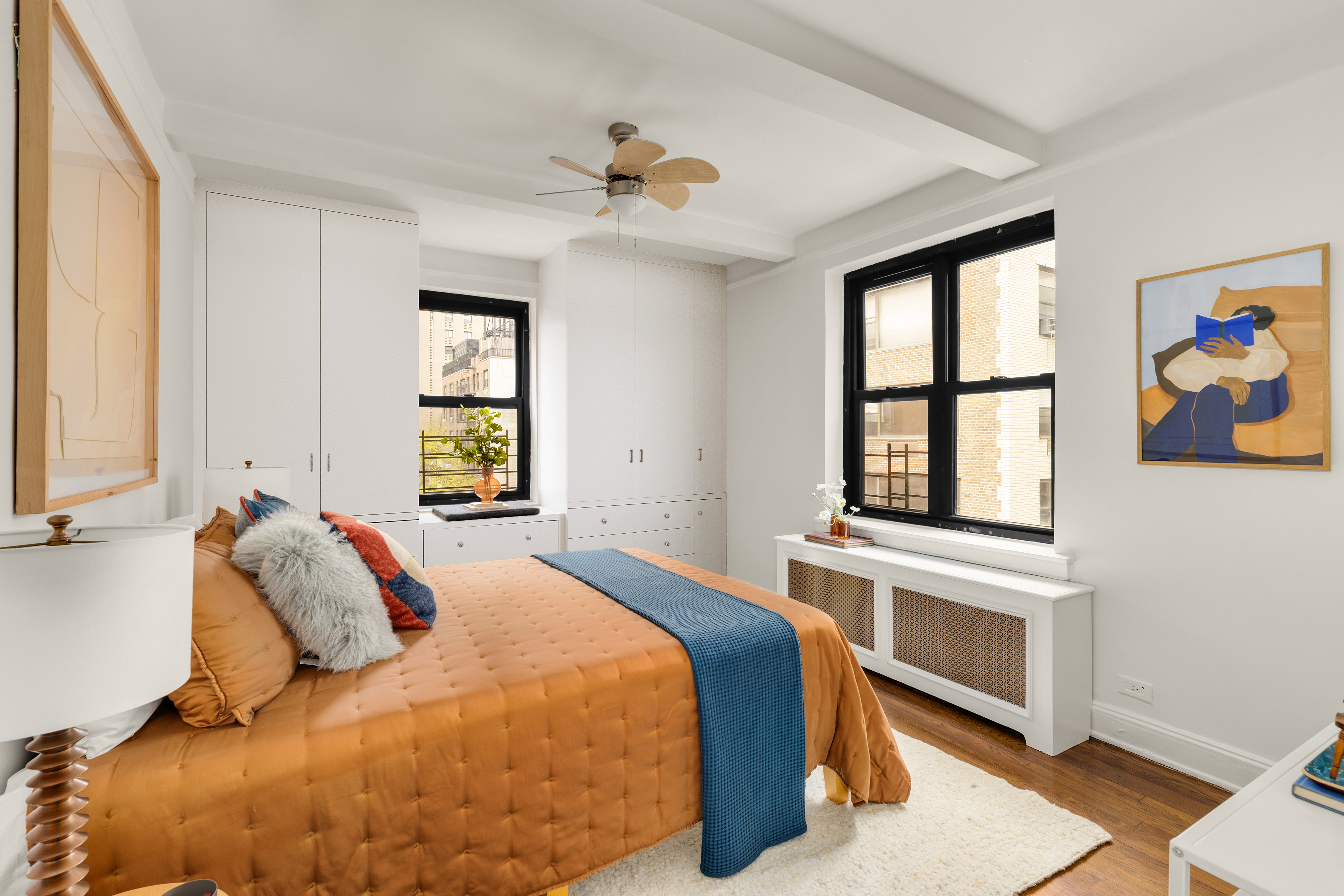 245 East 72nd Street, Unit 8G Manhattan, NY 10021 - Photo 6 of 10 a bedroom with a bed and a window