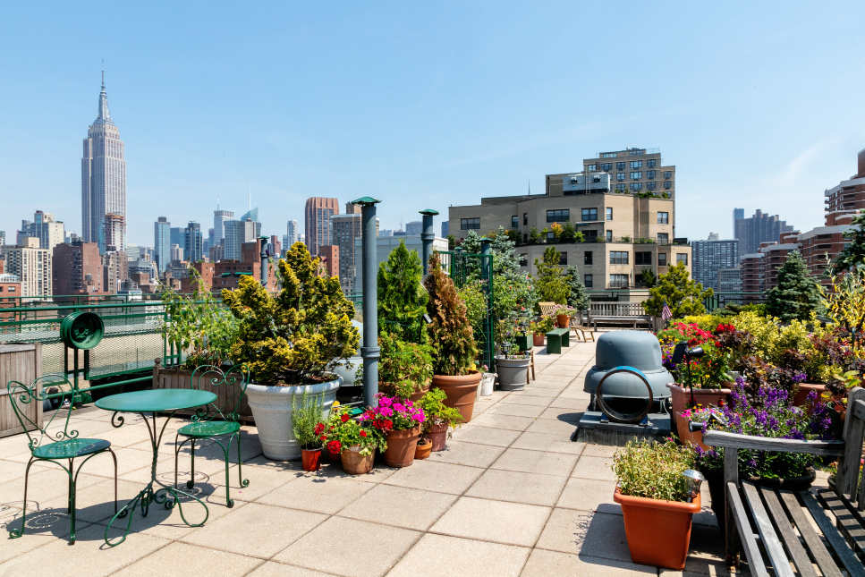 245 East 24th Street, Unit 9B Manhattan, NY 10010 - Photo 6 of 6 a view of a terrace with chairs potted plants