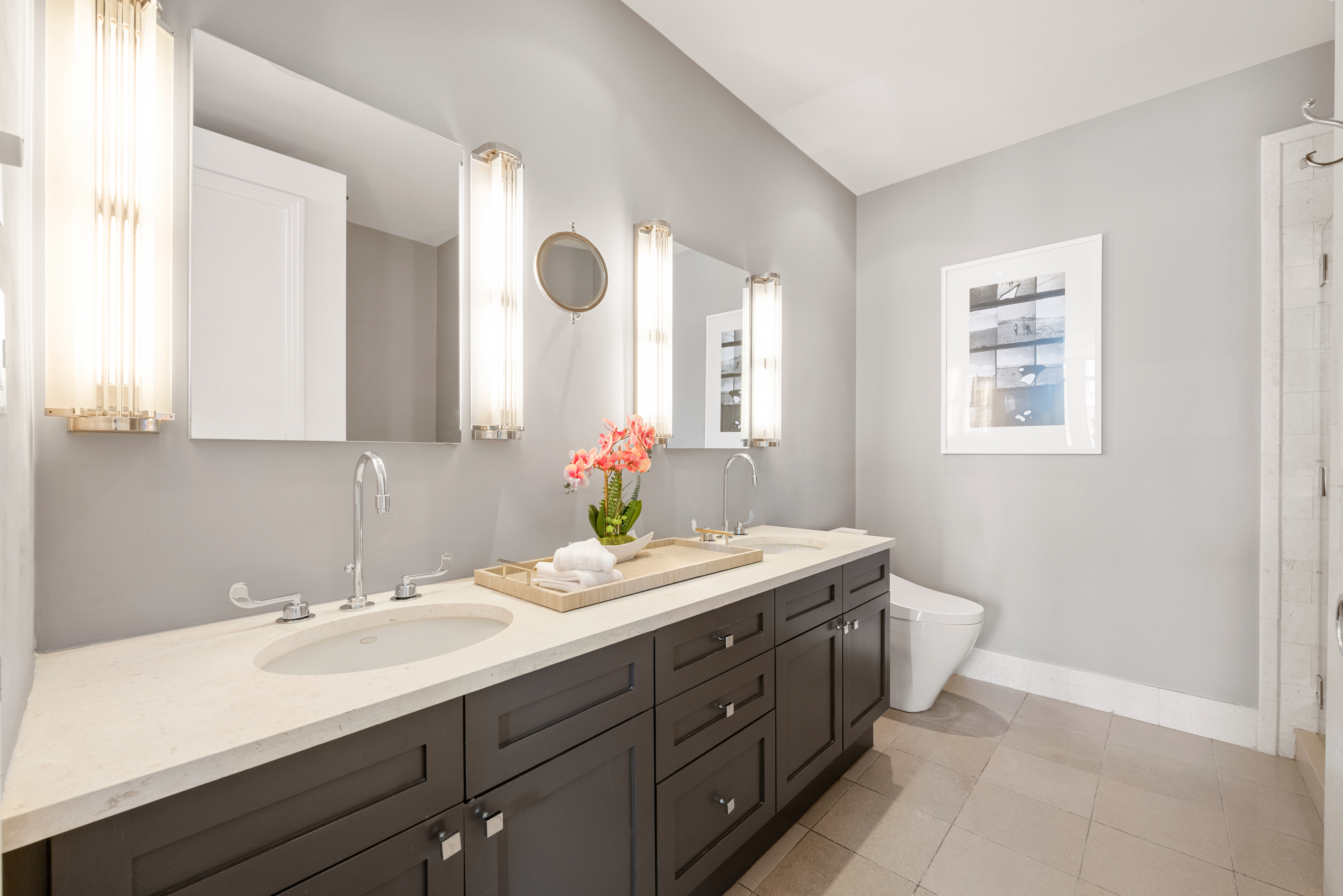 252 7th Avenue, Unit 17I Manhattan, NY 10001 - Photo 15 of 17 a bathroom with a double vanity sink and a mirror