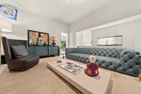 a view of a dining room that has a table and chairs in it