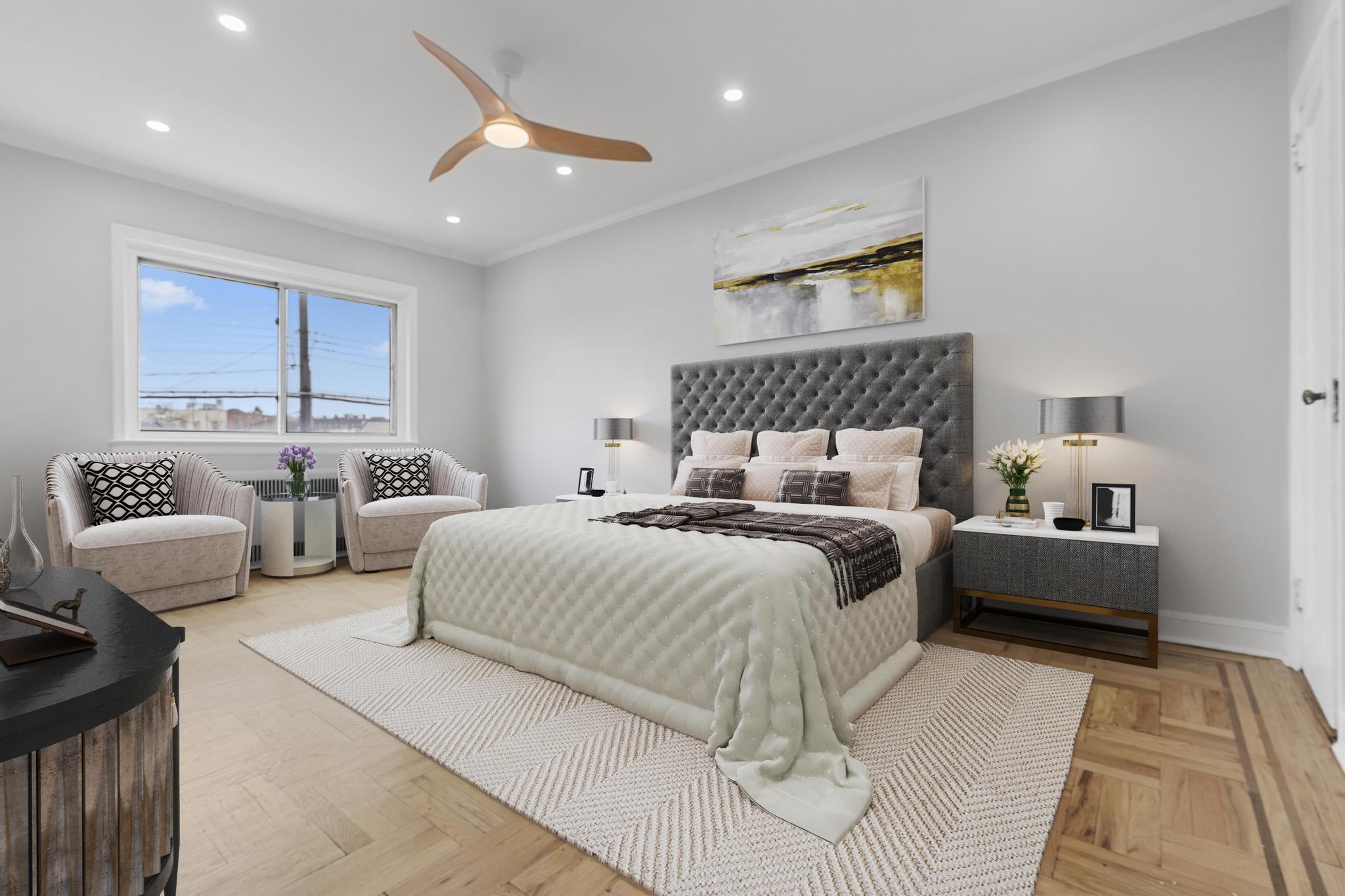 237 Remsen Avenue, Unit 1 Brooklyn, NY 11212 - Photo 6 of 16 a bedroom with double bed and a couch