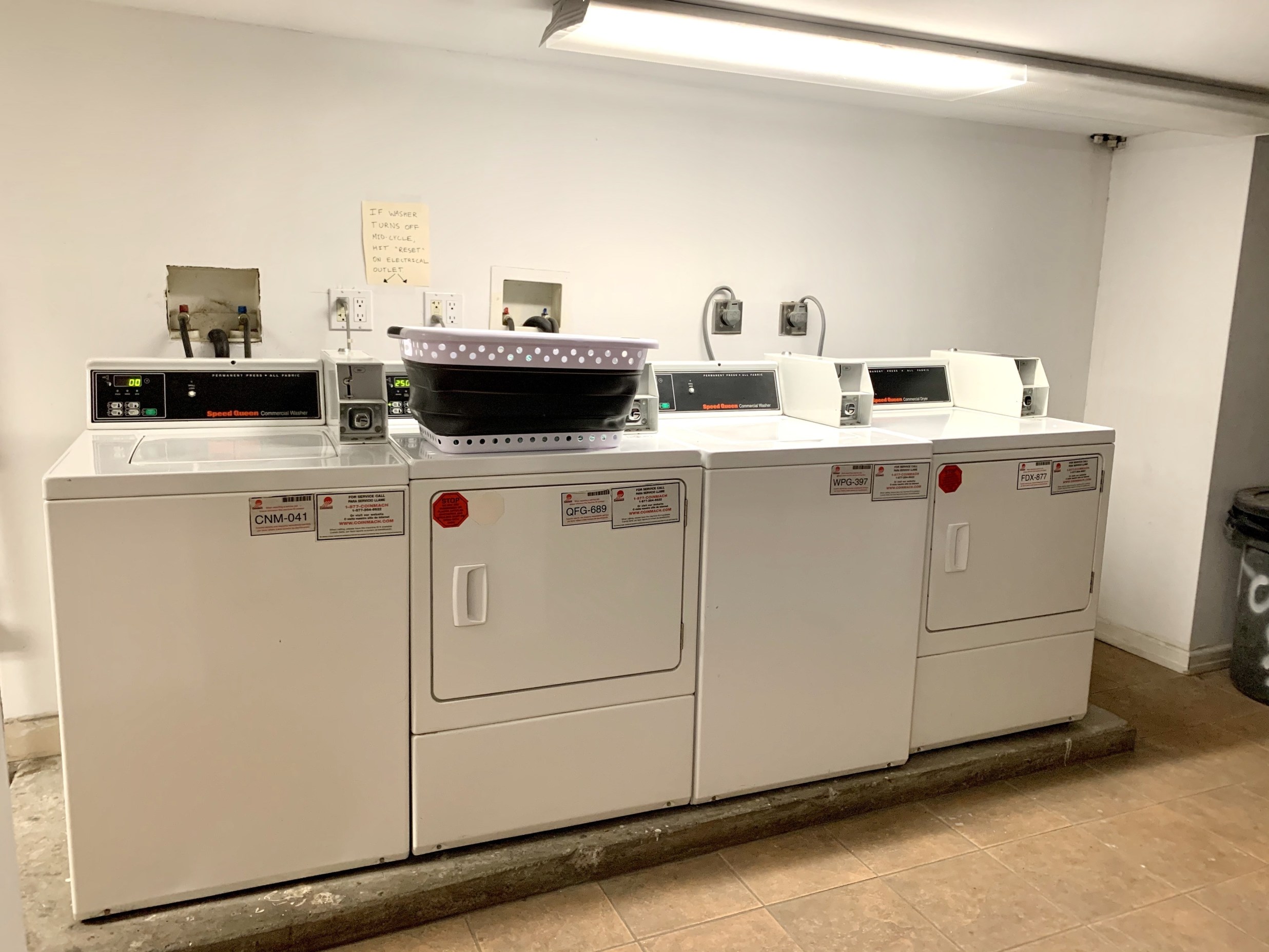 237 East 88th Street, Unit 401 Manhattan, NY 10128 - Photo 5 of 7 a utility room with dryer and washer