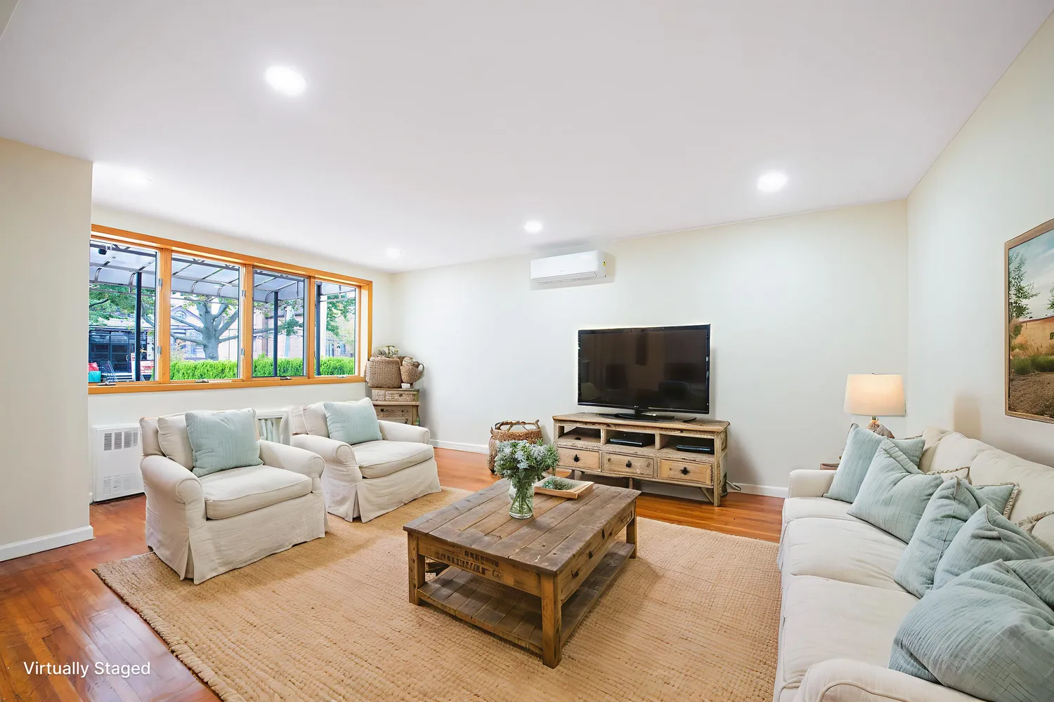 a living room with furniture and a flat screen tv