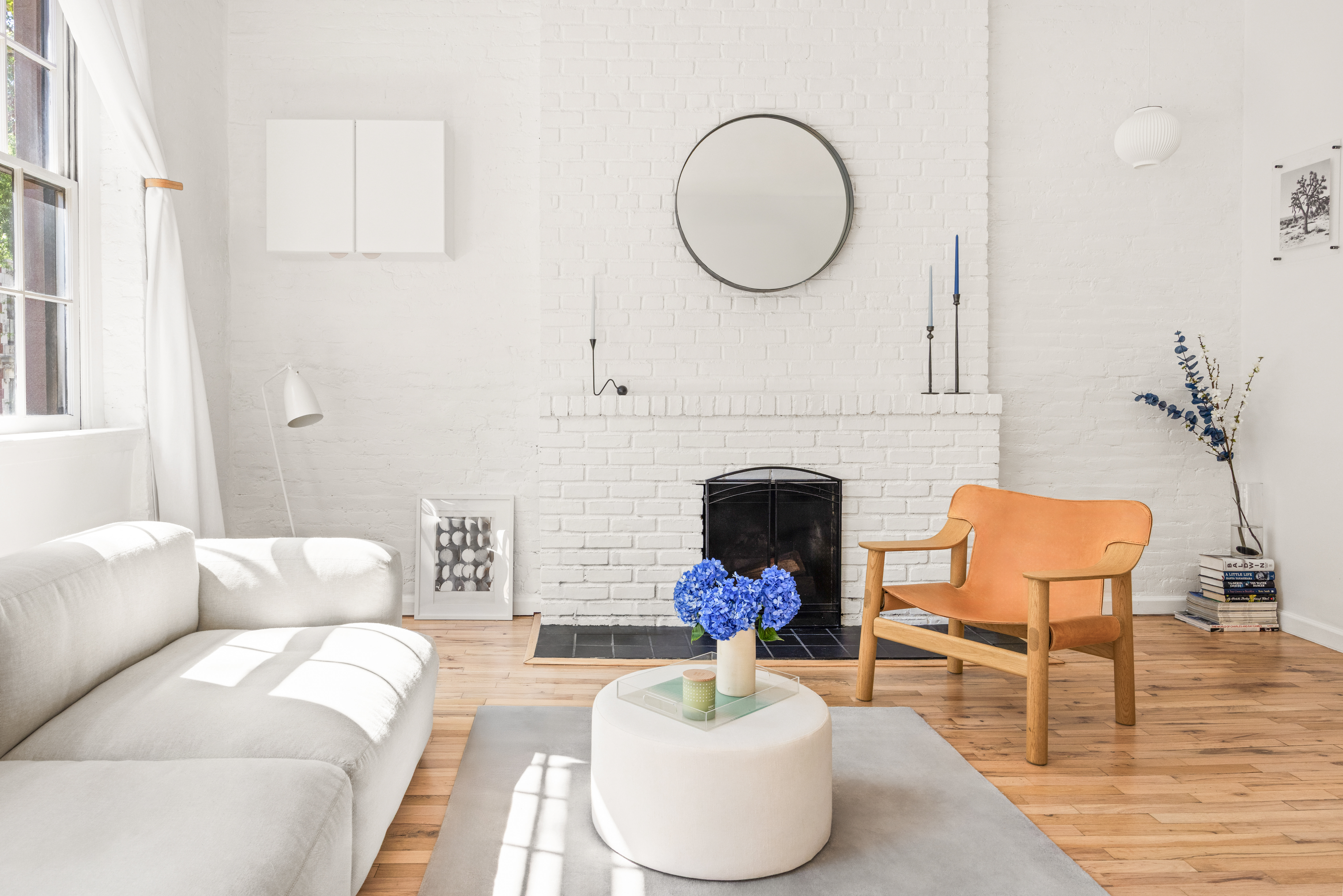 135 Amity Street, Unit 1A Brooklyn, NY 11201 - Photo 3 of 9 a living room with furniture a fireplace and a large window