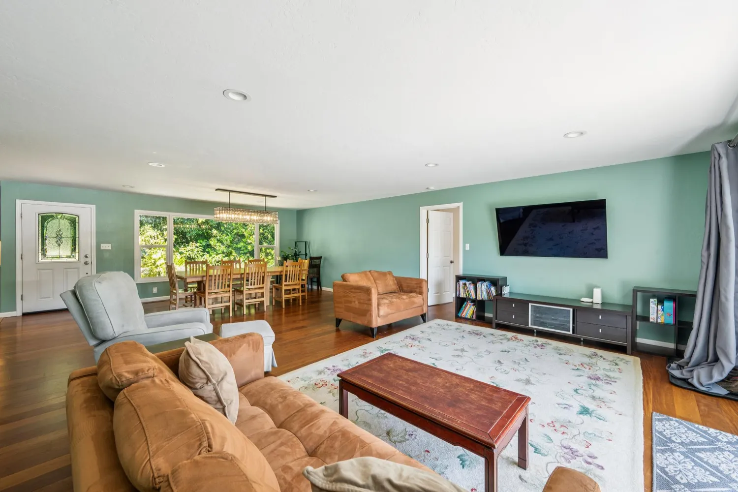 a kitchen with stainless steel appliances granite countertop wooden cabinets a sink and a stove