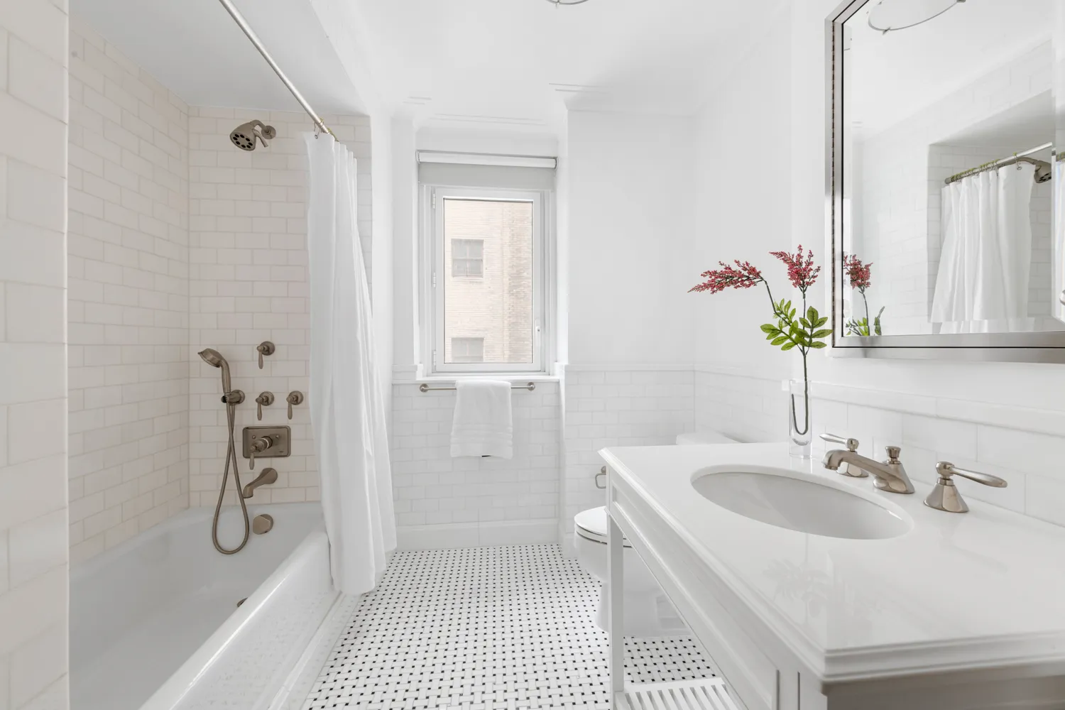 a bathroom with a sink a mirror and a shower
