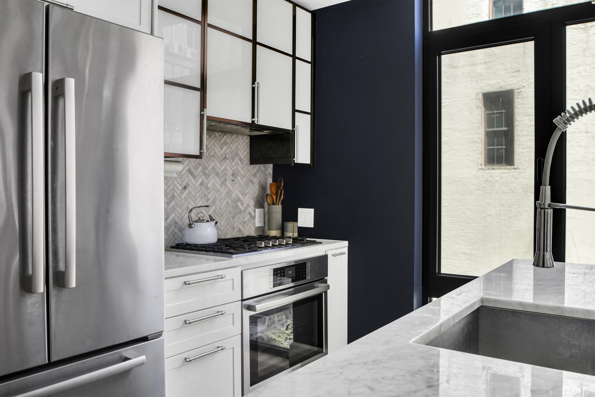 47 Bridge Street, Unit 3DD Brooklyn, NY 11201 - Photo 6 of 24 a kitchen with stainless steel appliances granite countertop a refrigerator and a sink