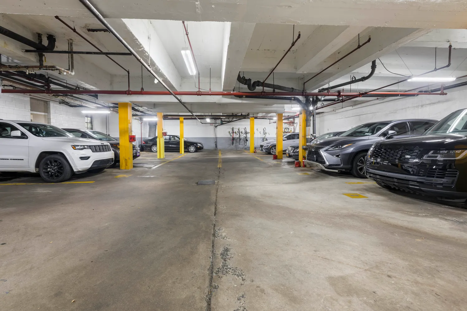 a view of parking garage with cars
