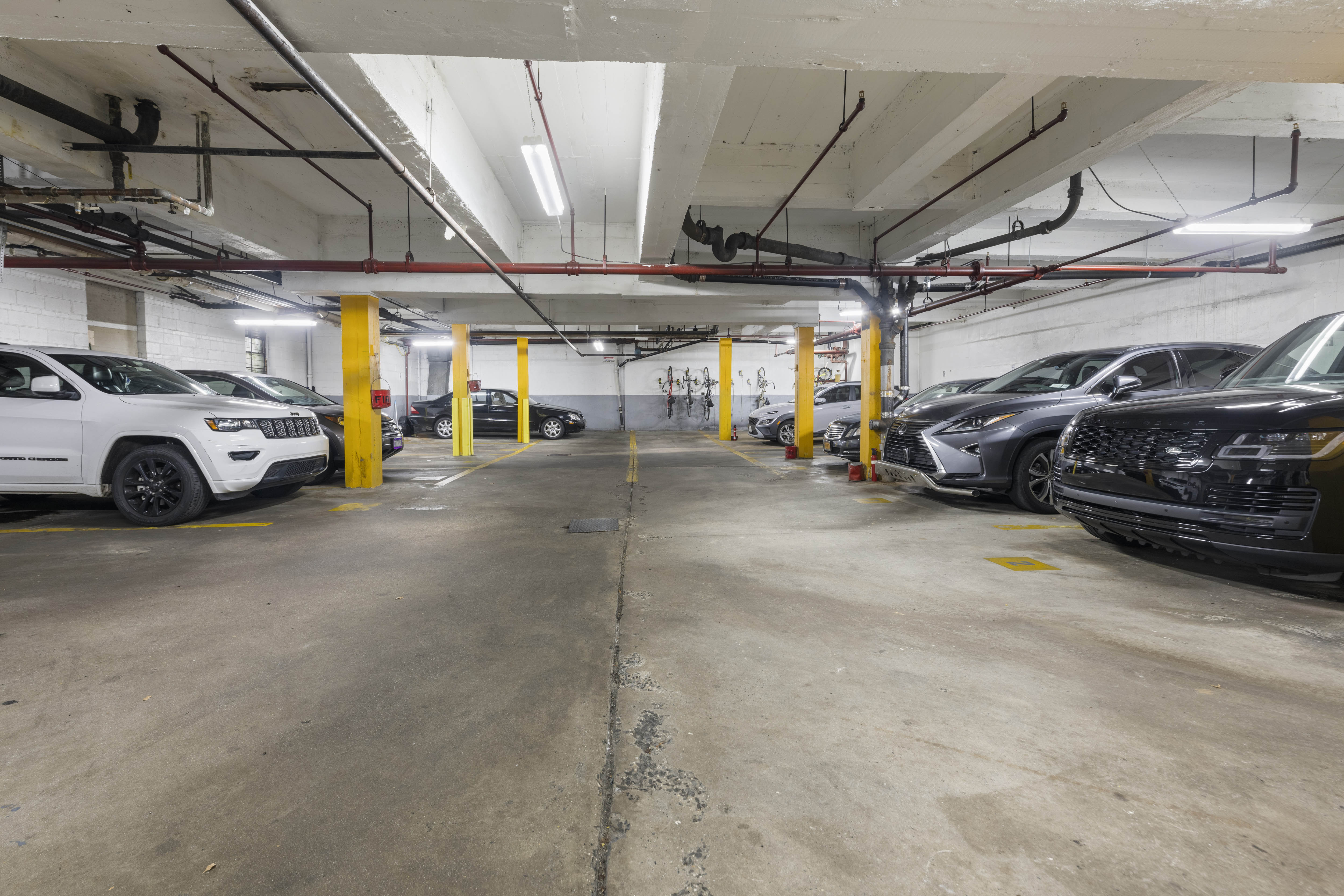 2750 Johnson Avenue, Unit 7G Bronx, NY 10463 - Photo 10 of 12 a view of parking garage with cars