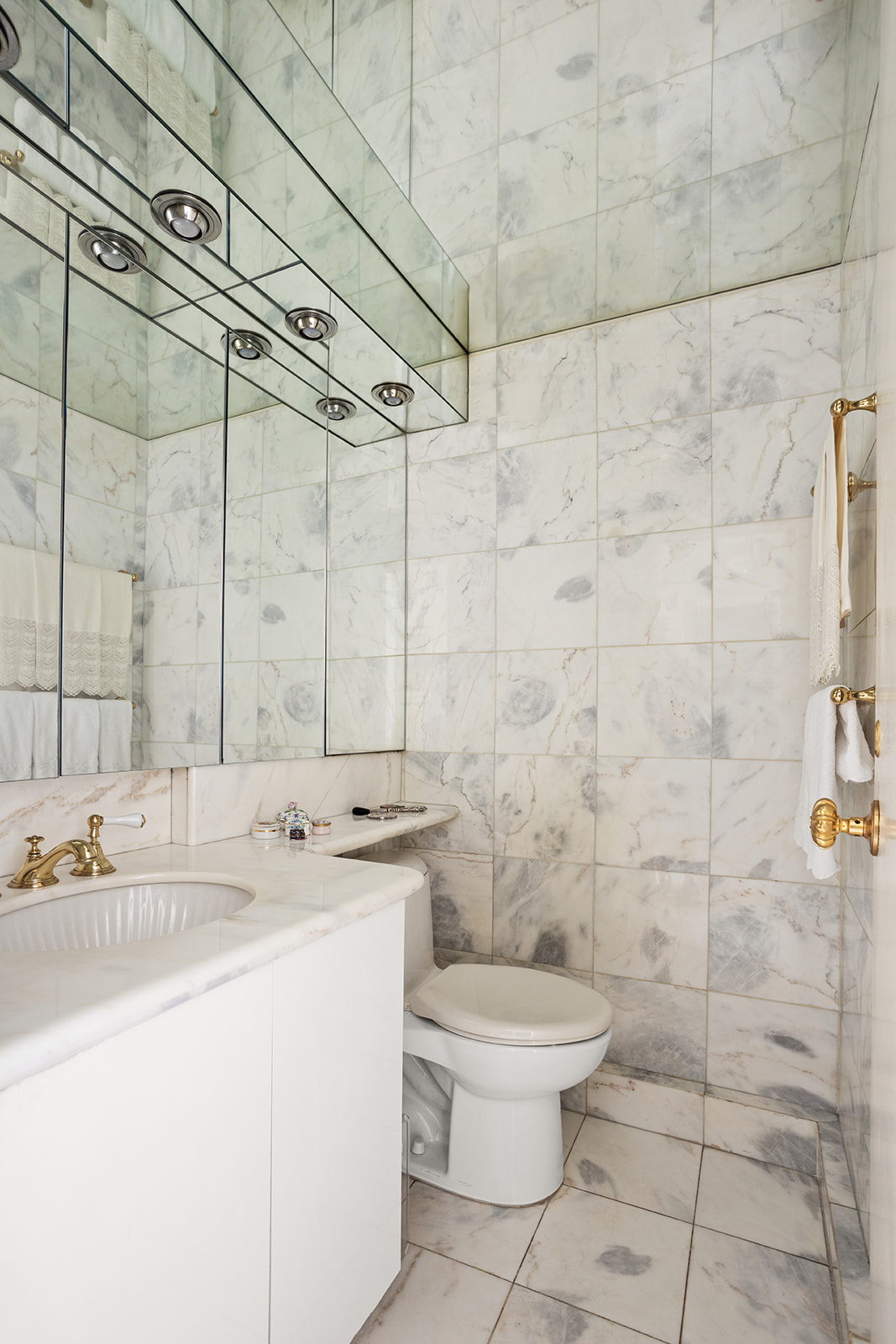 50 East 79th Street, Unit 12B Manhattan, NY 10075 - Photo 9 of 13 a bathroom with a sink toilet and shower