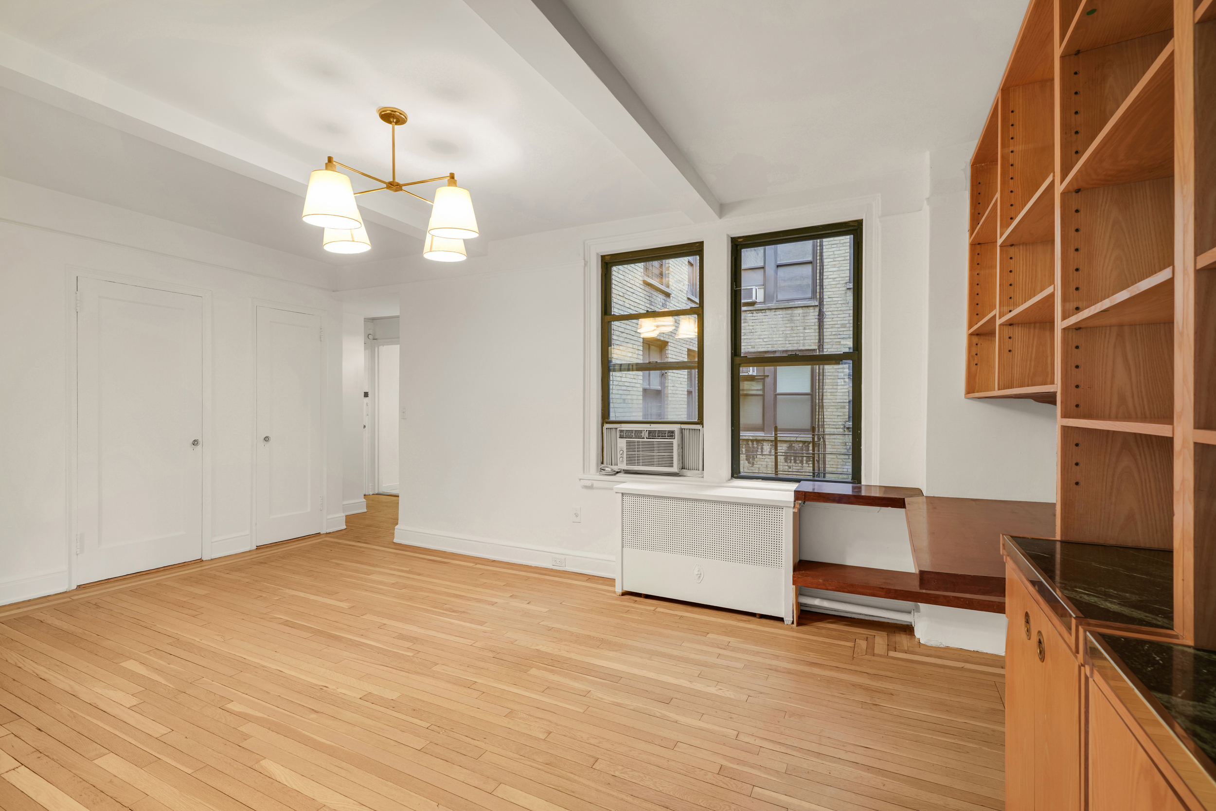 74 West 68th Street, Unit 5A Manhattan, NY 10023 - Photo 13 of 25 wooden floor in an empty room with a window