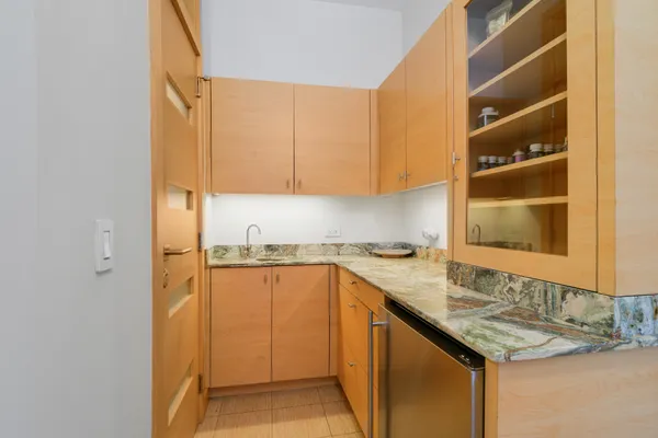 a kitchen with a sink and a refrigerator