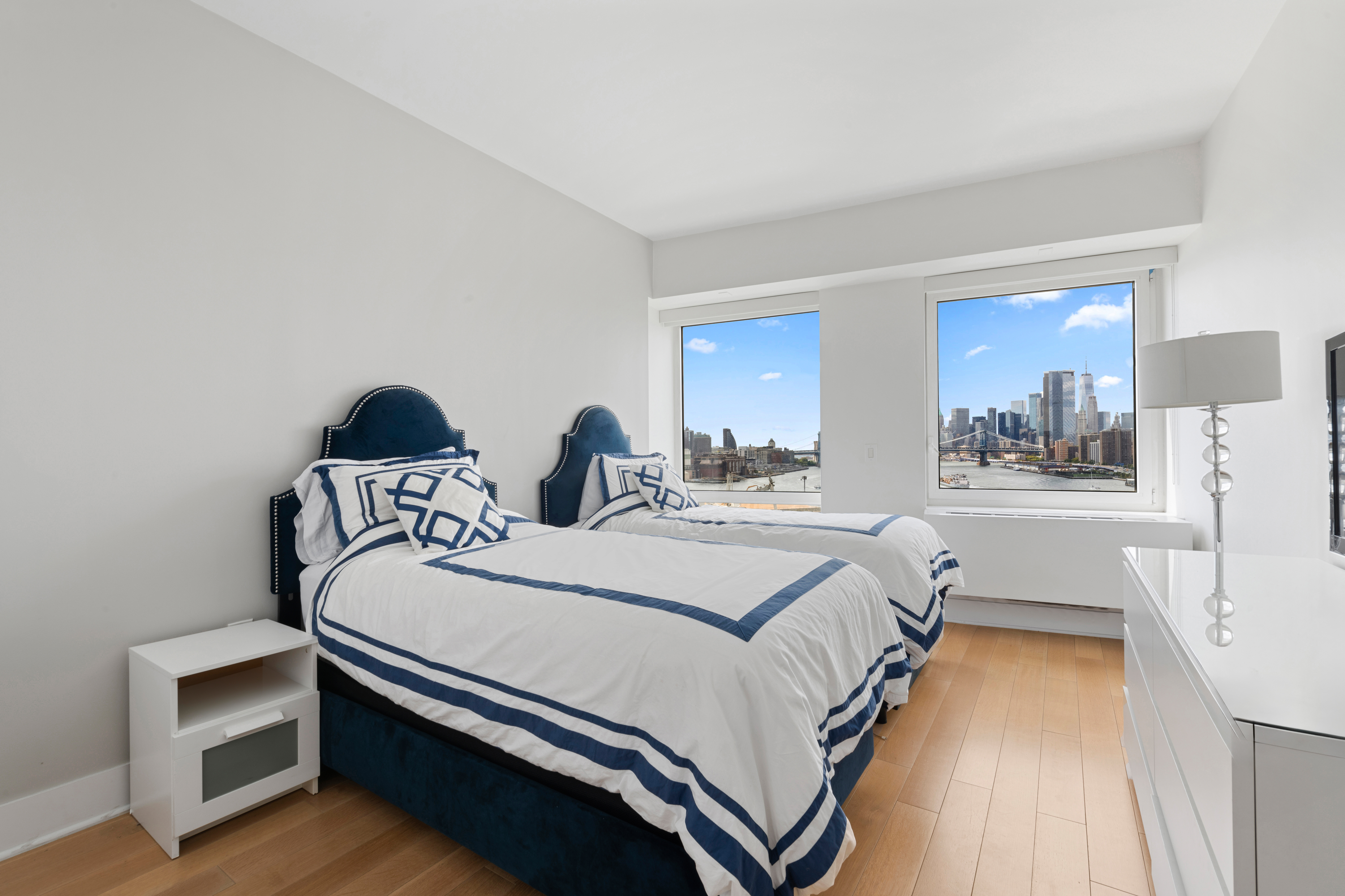 446 Kent Avenue, Unit 14A Brooklyn, NY 11249 - Photo 13 of 19 a bedroom with bed and a window