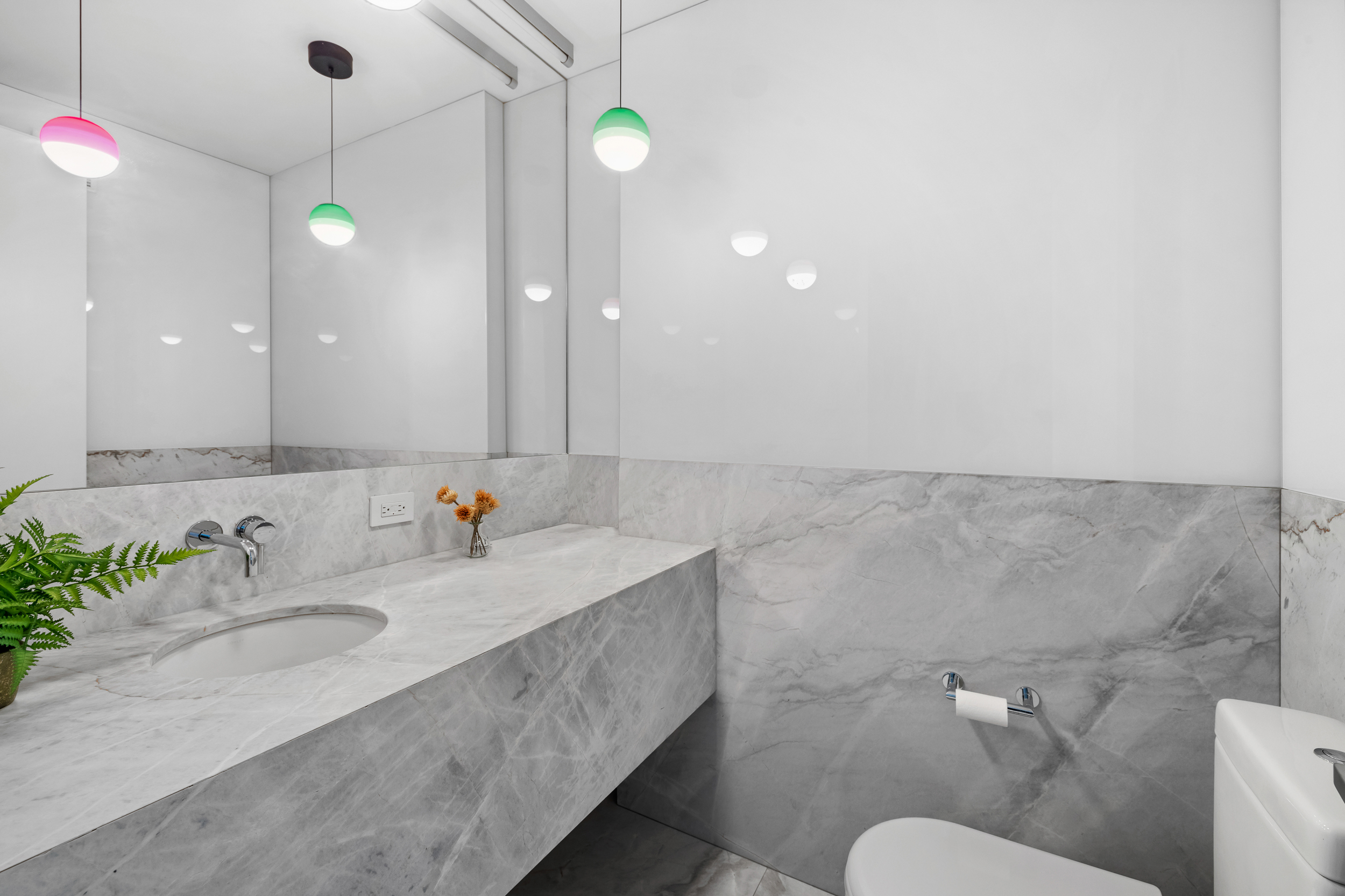 210 Pacific Street, Unit 3E Brooklyn, NY 11201 - Photo 9 of 14 a bathroom with a sink vanity mirror and toilet