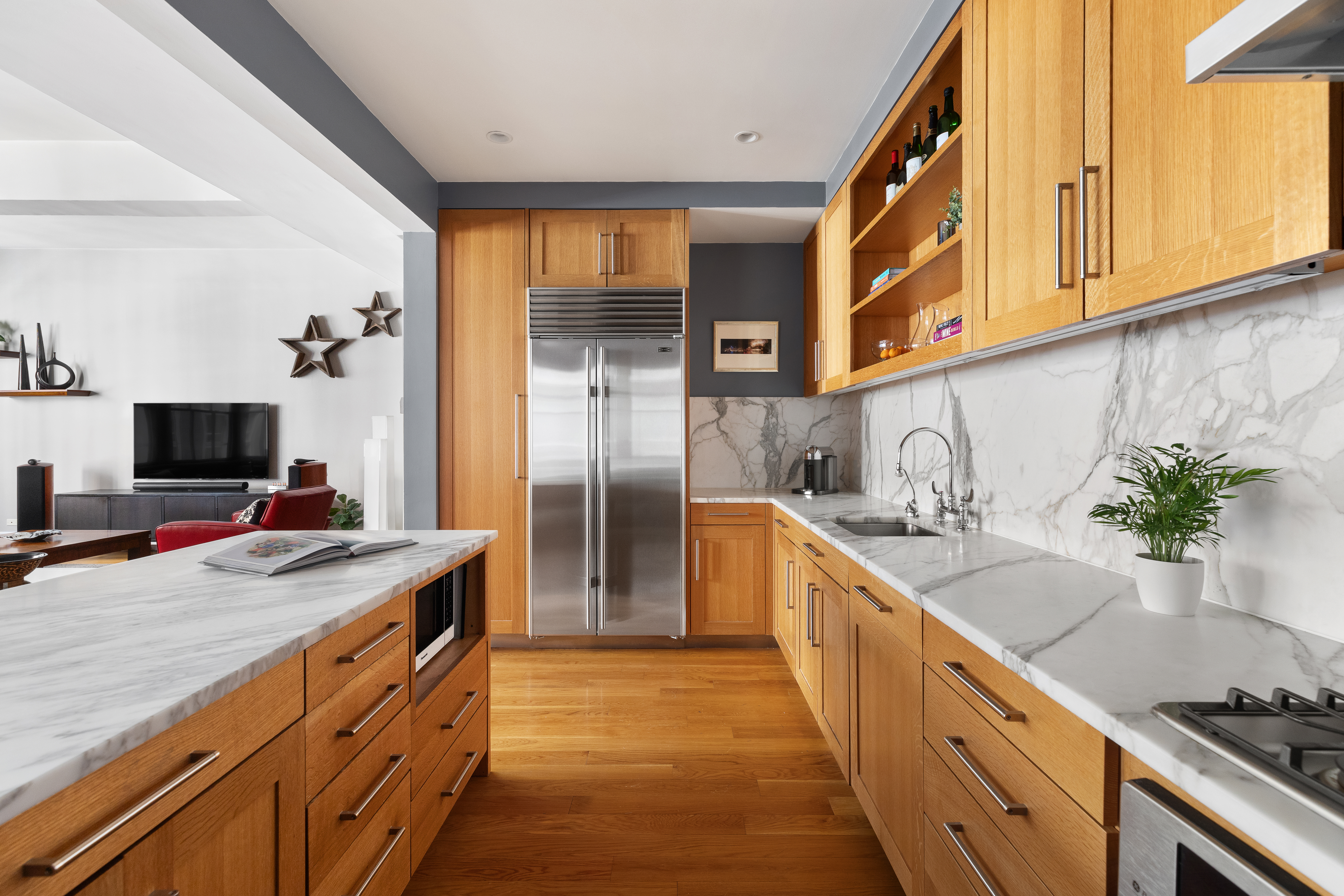 130 West 30th Street, Unit 3B Manhattan, NY 10001 - Photo 4 of 15 a kitchen with stainless steel appliances granite countertop a sink and a stove