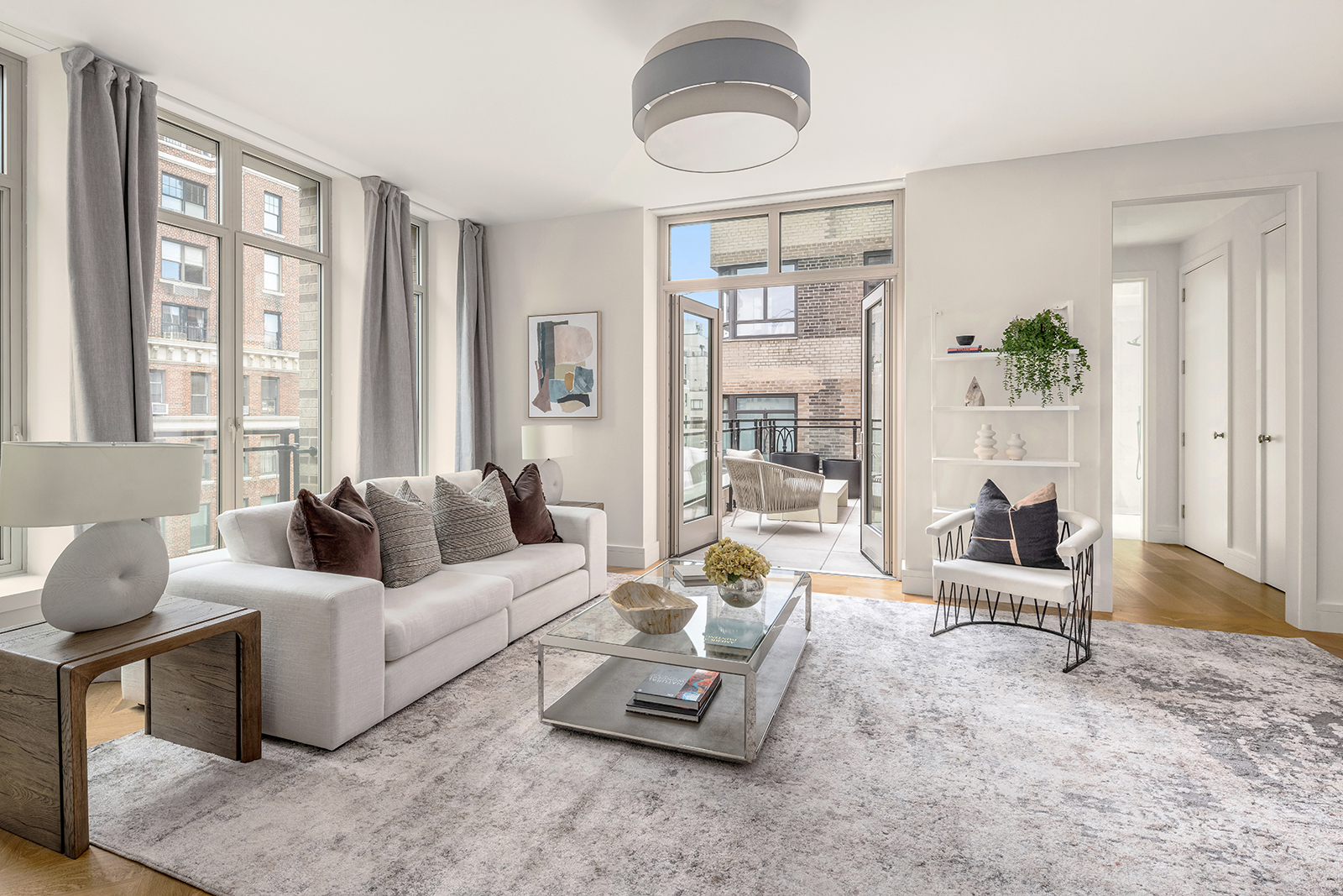 1228 Madison Avenue, Unit 10 Manhattan, NY 10128 - Photo 4 of 21 a living room with furniture and a large window