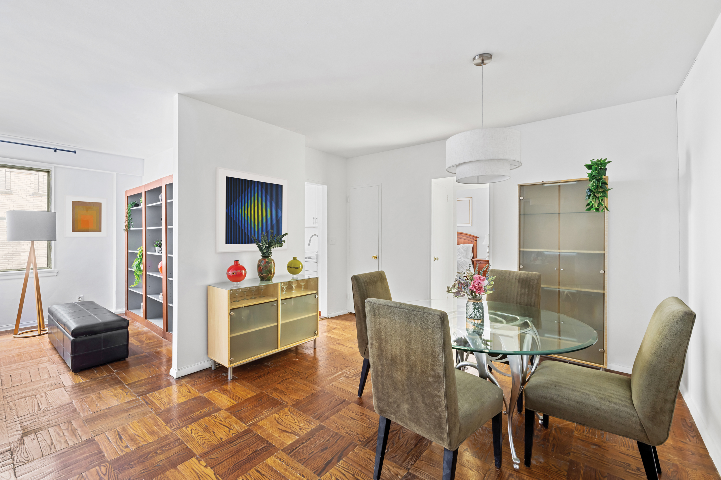 12 Beekman Place, Unit 9D Manhattan, NY 10022 - Photo 3 of 8 a view of a livingroom with furniture and a flat screen tv