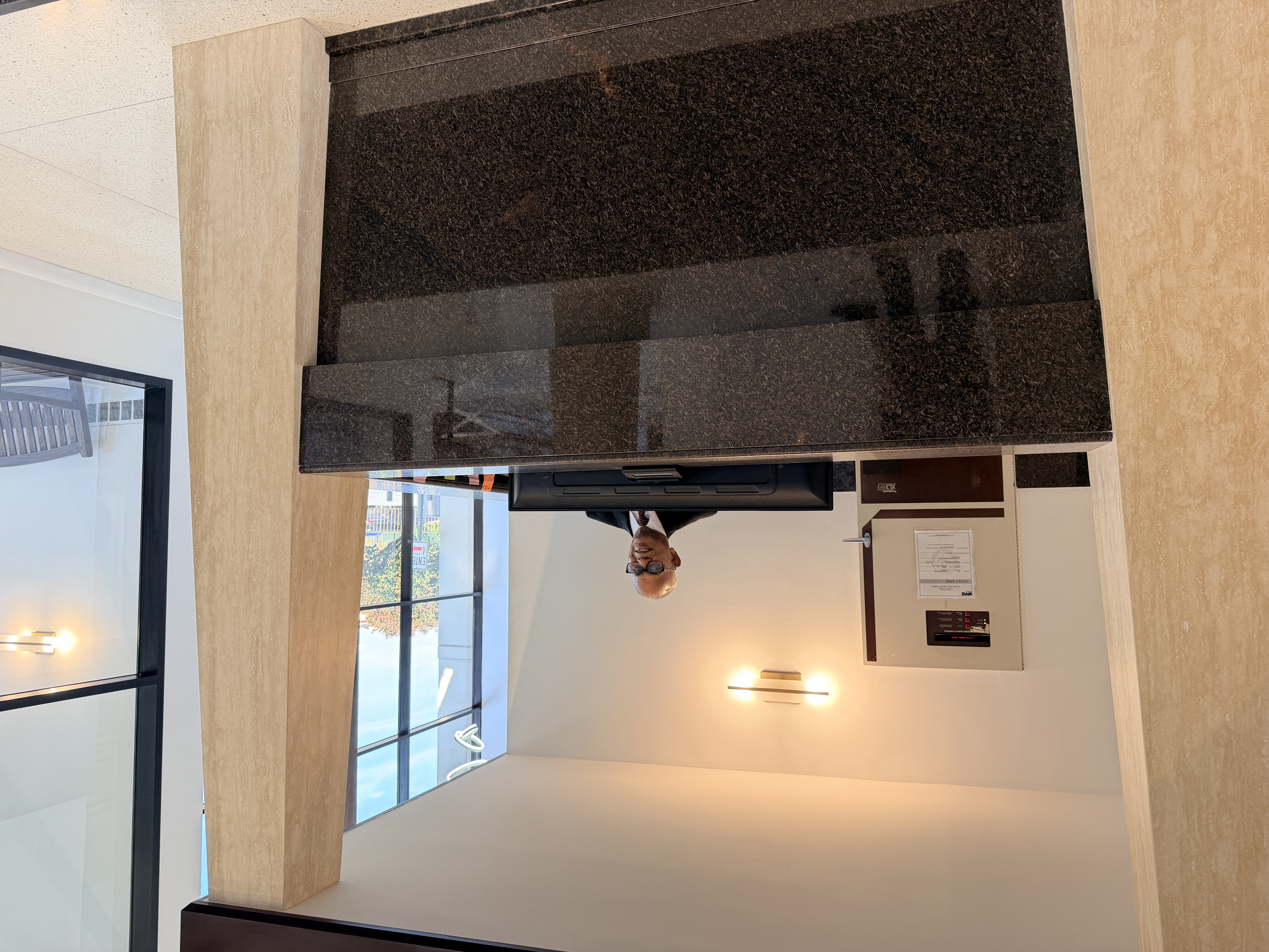 2540 Shore Boulevard, Unit 4S Queens, NY 11102 - Photo 21 of 31 a kitchen with a sink and a mirror