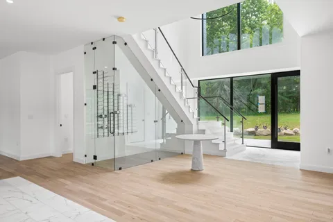 a view of an entryway with wooden floor