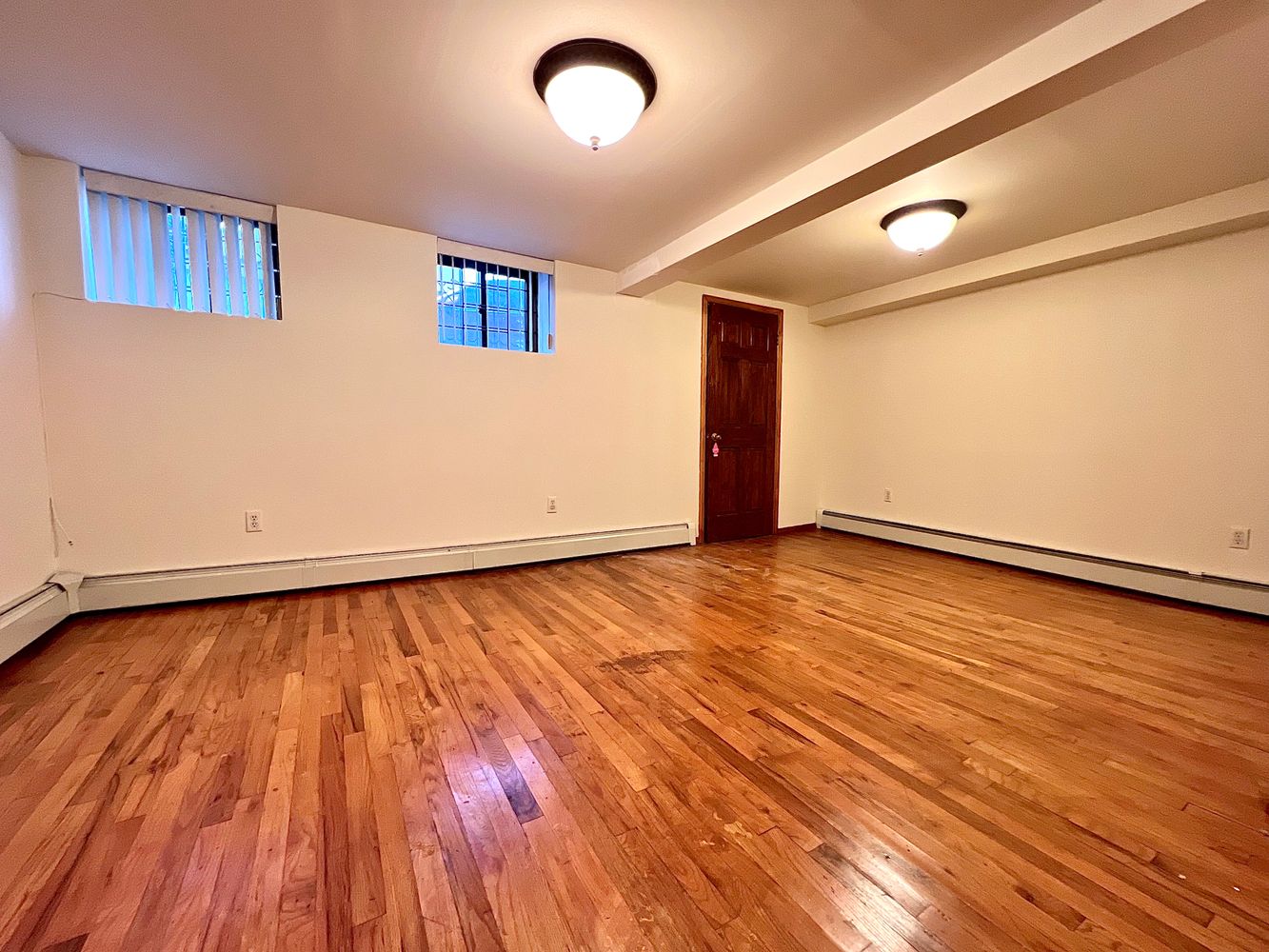 1561 Carroll Street, Unit Undisclosed Brooklyn, NY 11213 - Photo 1 of 9 a view of an empty room with wooden floor