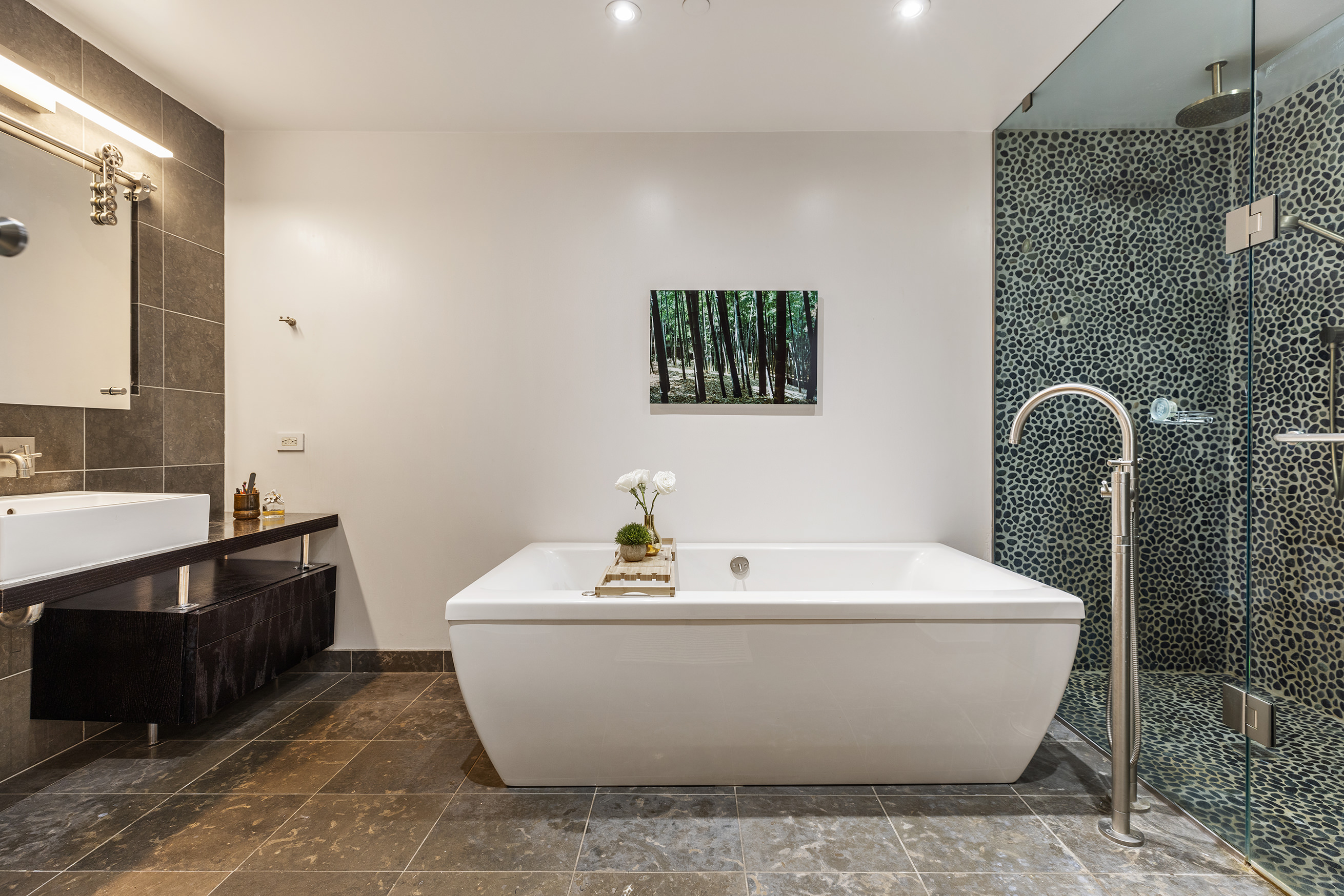271 West 122nd Street, Unit A Manhattan, NY 10027 - Photo 11 of 19 a white bath tub sitting in a bathroom