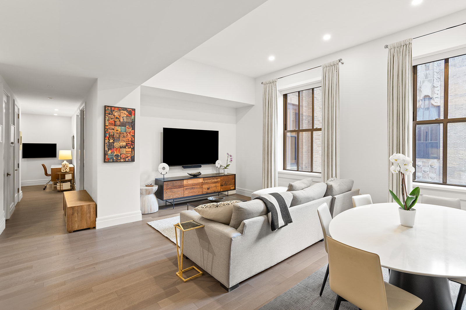 100 Barclay Street, Unit 17J Manhattan, NY 10007 - Photo 1 of 18 a living room with furniture and a flat screen tv
