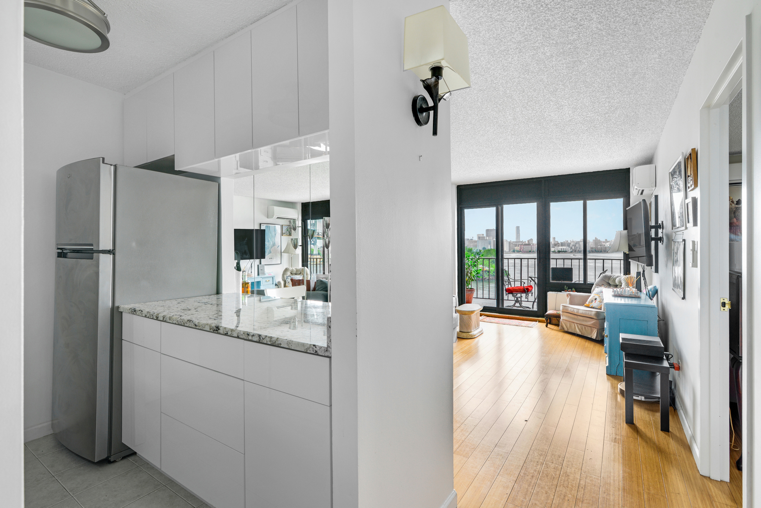 2540 Shore Boulevard, Unit 4S Queens, NY 11102 - Photo 5 of 21 a kitchen with stainless steel appliances granite countertop a refrigerator and a sink