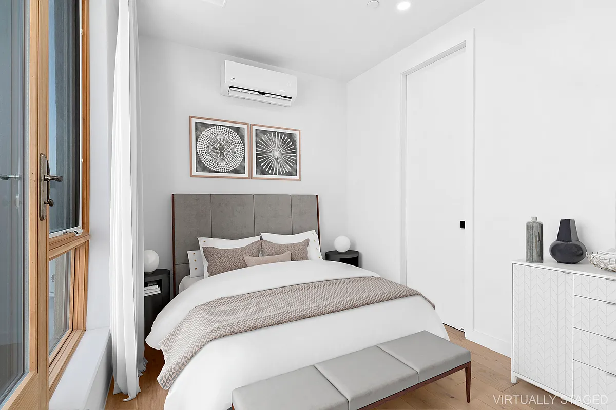 496 Wilson Avenue, Unit 4A Brooklyn, NY 11221 - Photo 7 of 10 a bedroom with a bed and a window