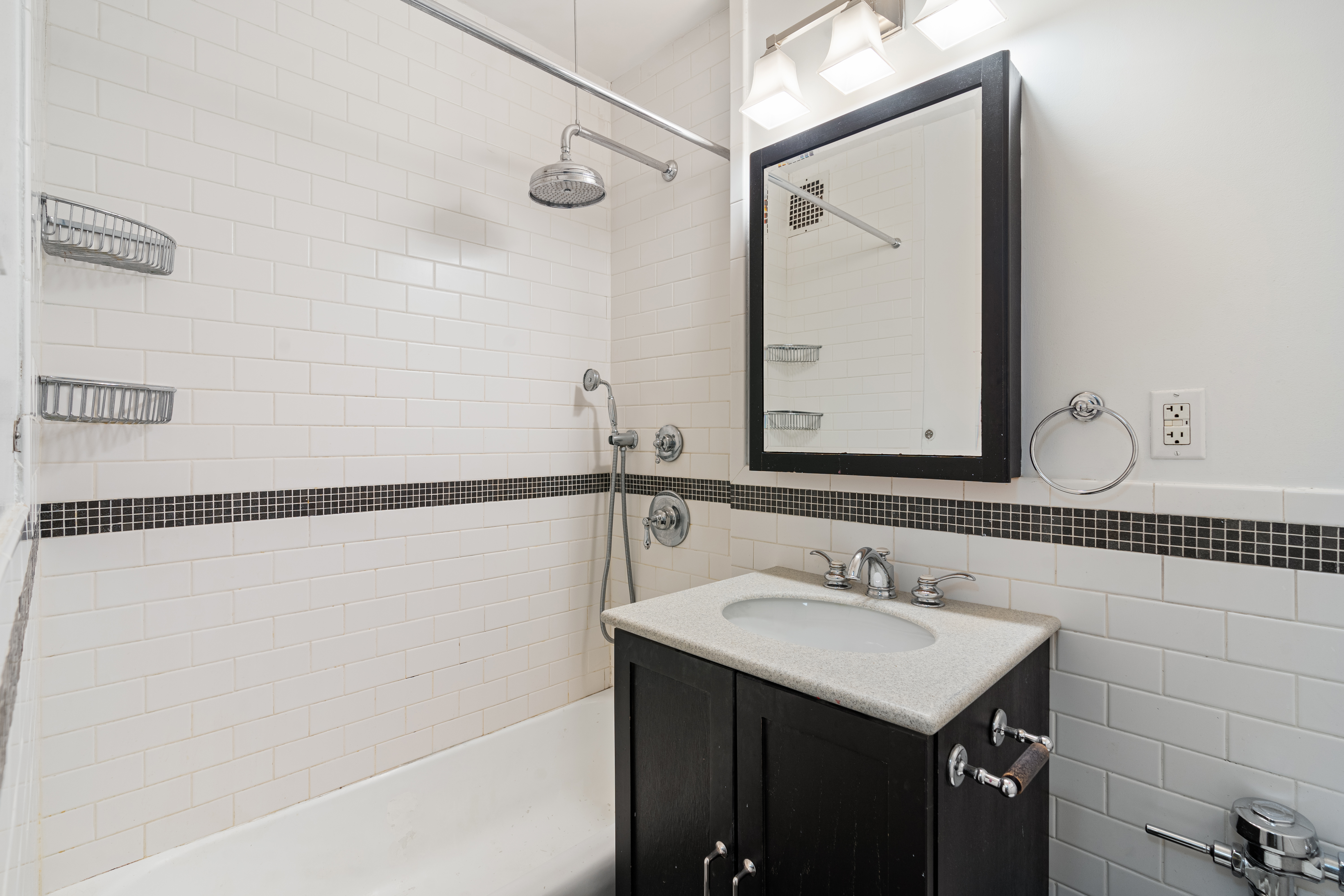 14 Horatio Street, Unit 2J Manhattan, NY 10014 - Photo 6 of 9 a bathroom with a sink and a mirror
