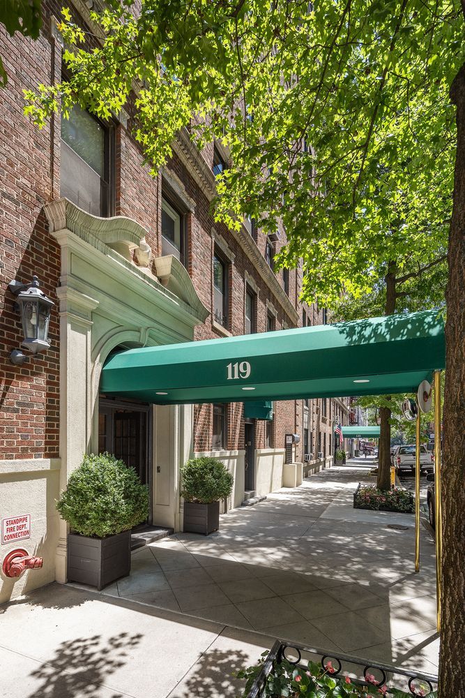 119 East 84th Street, Unit 9C Manhattan, NY 10028 - Photo 9 of 10 a front view of a house with garden