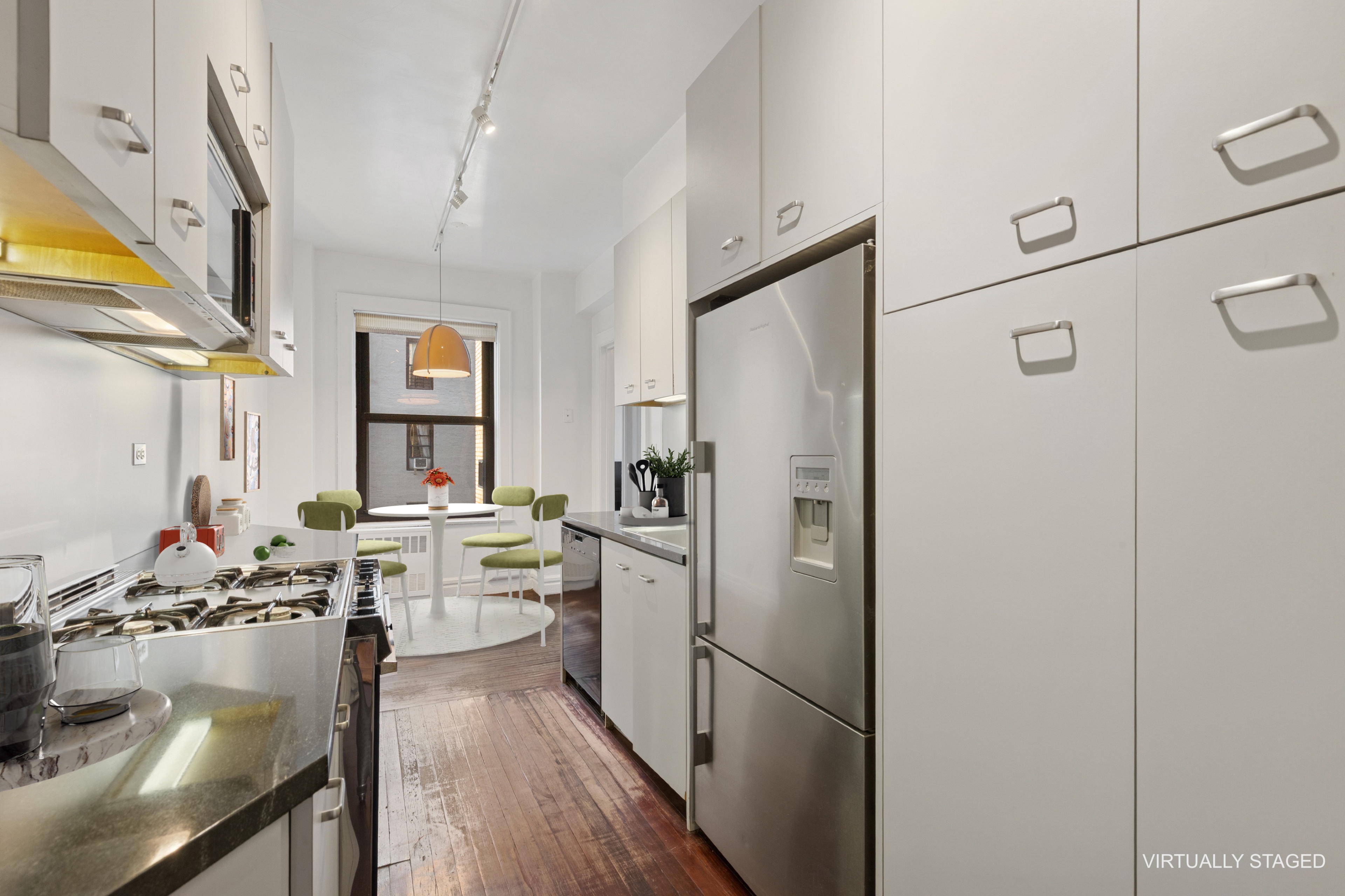 710 West End Avenue, Unit 14B Manhattan, NY 10025 - Photo 6 of 19 a kitchen with a refrigerator and a stove