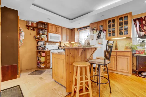 a kitchen with stainless steel appliances granite countertop a stove and a refrigerator