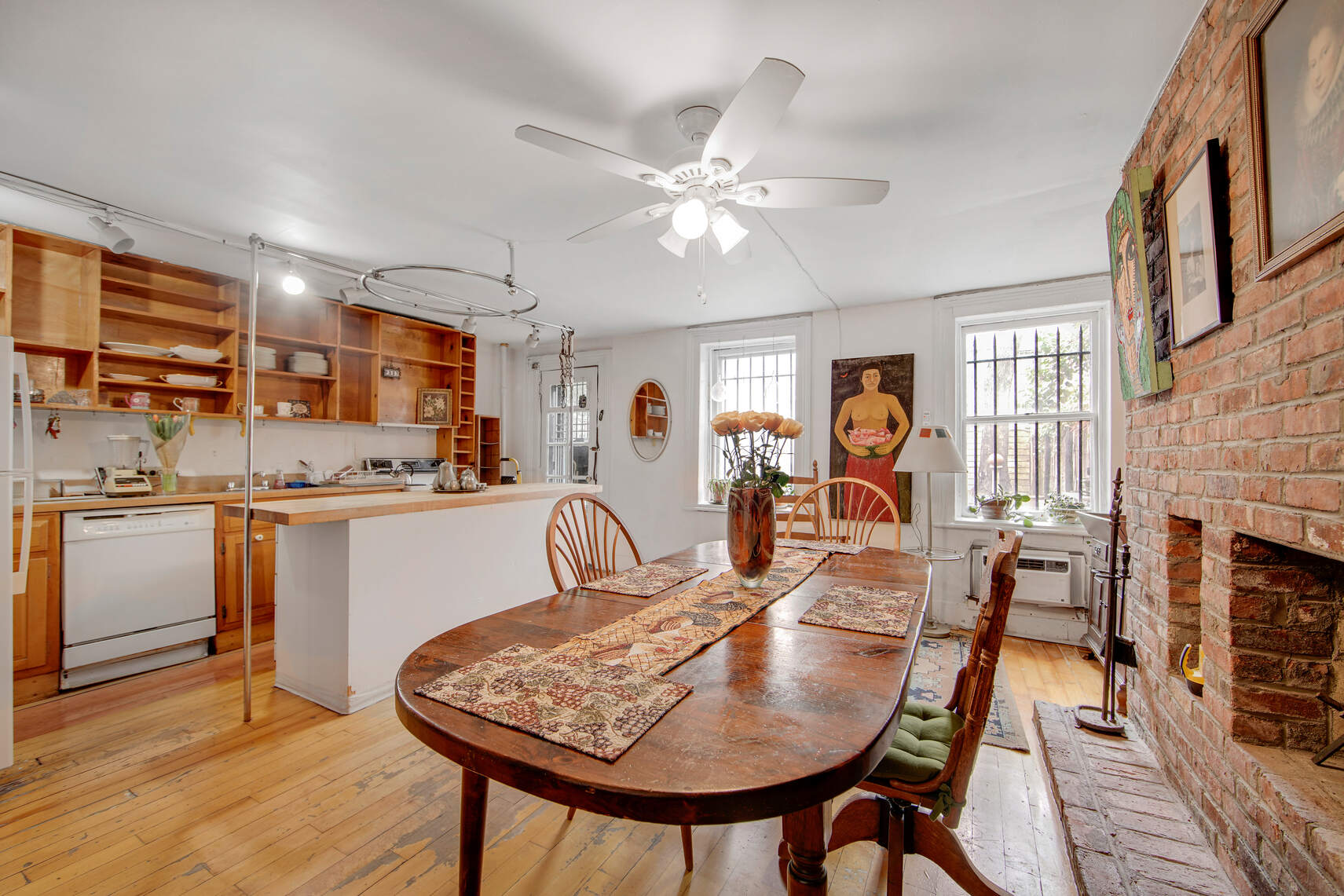 337 East 18th Street Manhattan, NY 10003 - Photo 5 of 16 a view of a dining room with furniture and wooden floor