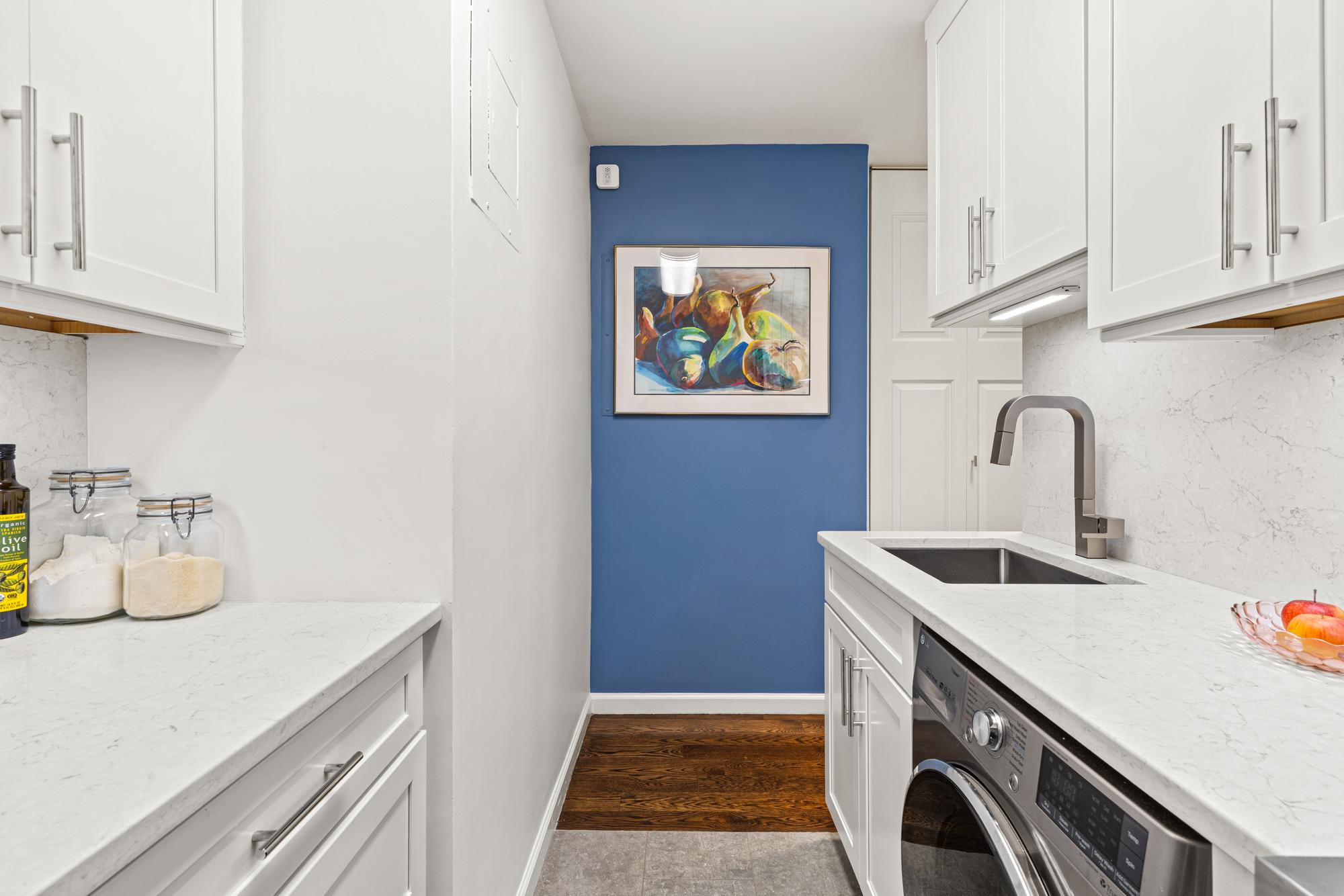 2025 Broadway, Unit 5K Manhattan, NY 10023 - Photo 7 of 15 a utility room with sink dryer and washer